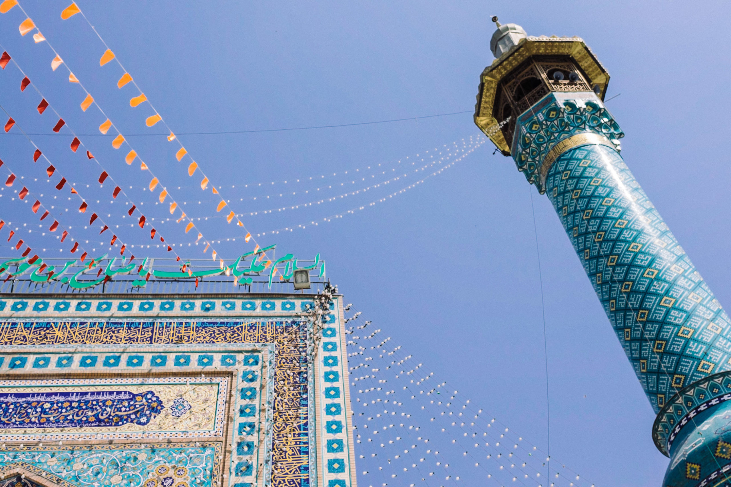 Imamzadeh Saleh minaret, Persian mosaic tilework, festive pennant bunting flags, HD Desktop wallpaper