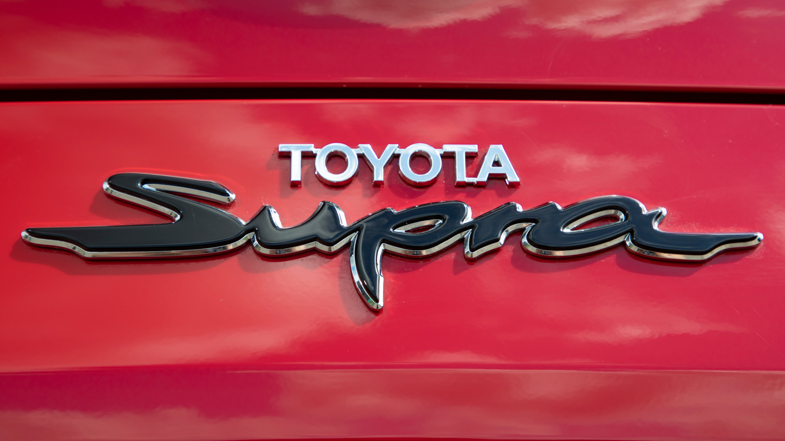 Toyota Supra script emblem, Chrome Toyota lettering, Glossy red car bodywork, HD Desktop wallpaper