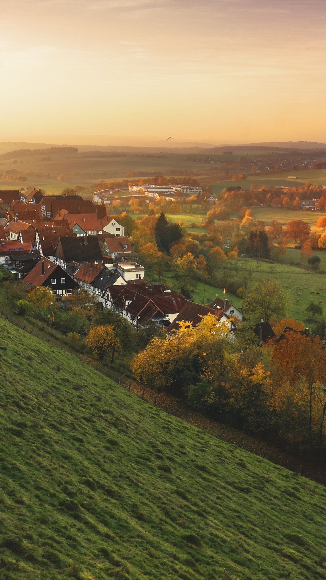 Peaceful town, Fall foliage, Mountain backdrop, Tranquil setting, 1250x2210 HD Phone