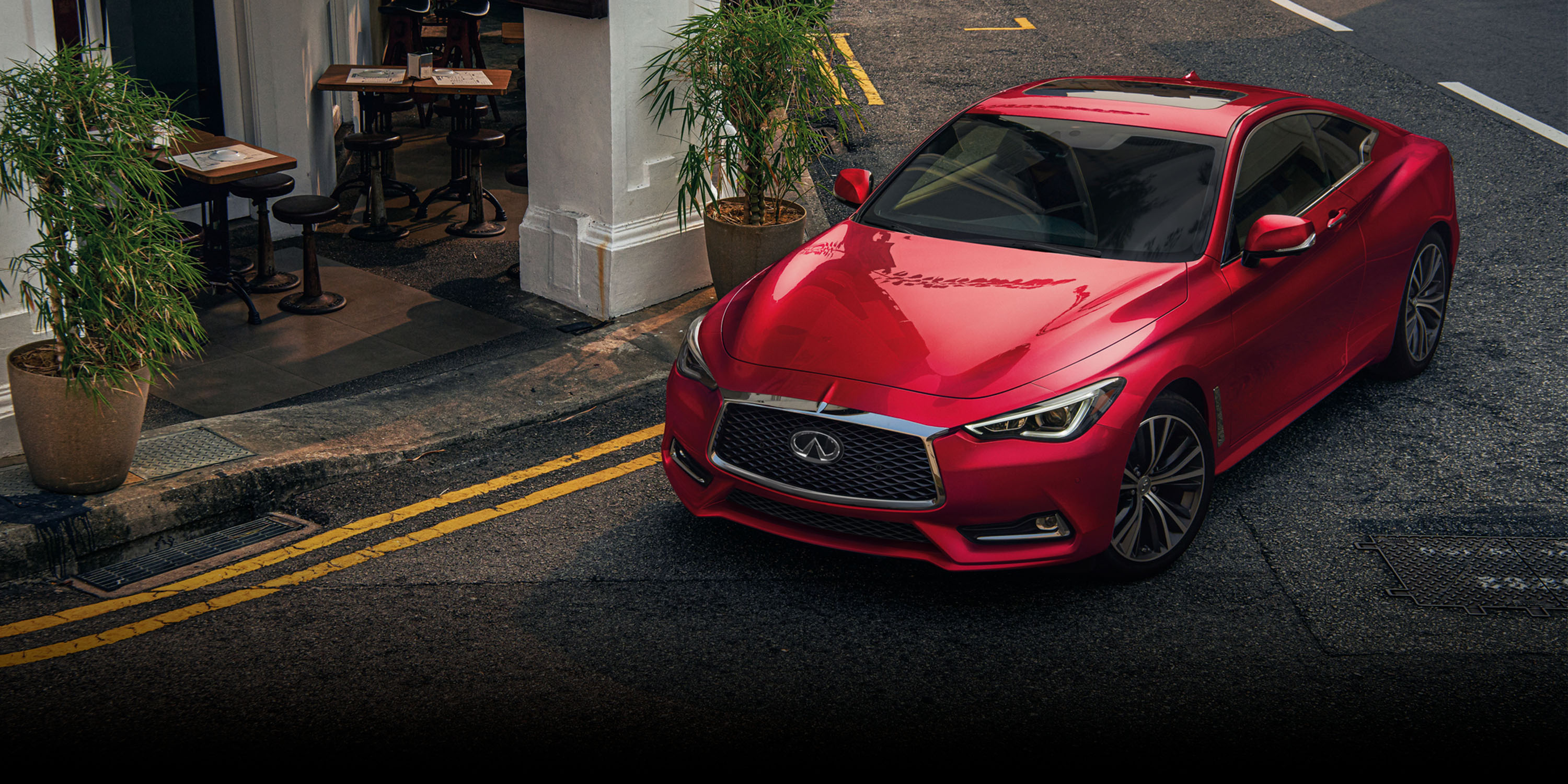 Infiniti Q60 coupe, sidewalk cafe seating, double yellow curb lines, Dual Screen Desktop wallpaper