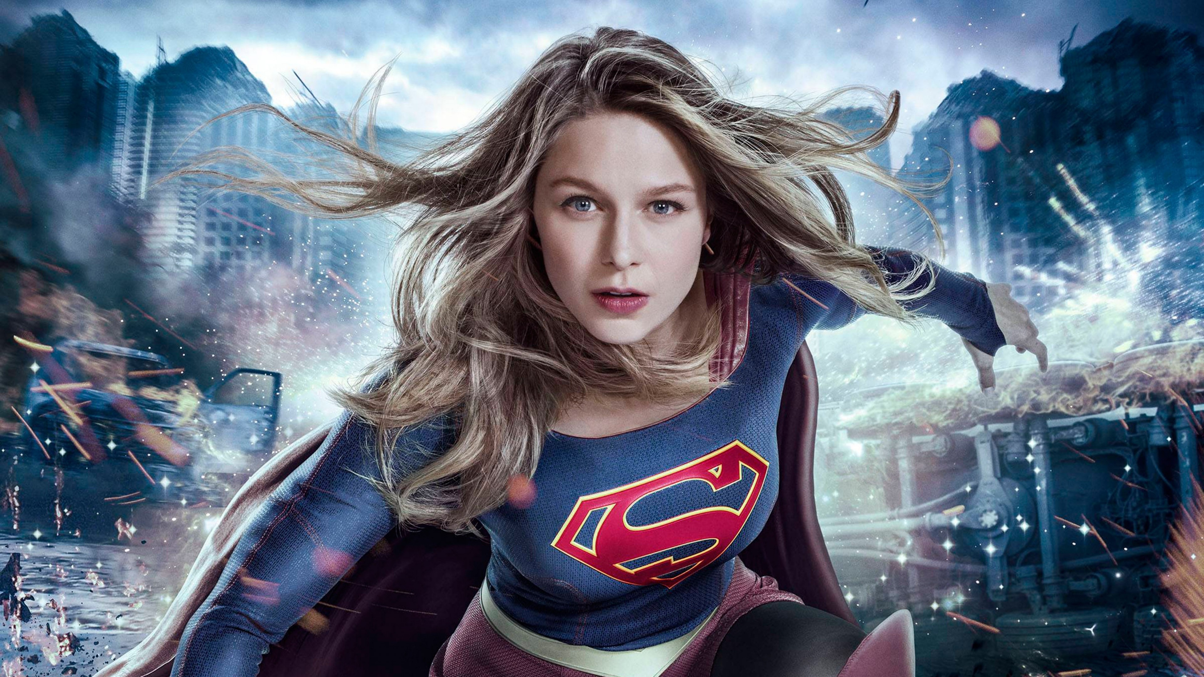 Melissa Benoist as Supergirl, House of El insignia, Destroyed city battleground, 4K Desktop wallpaper