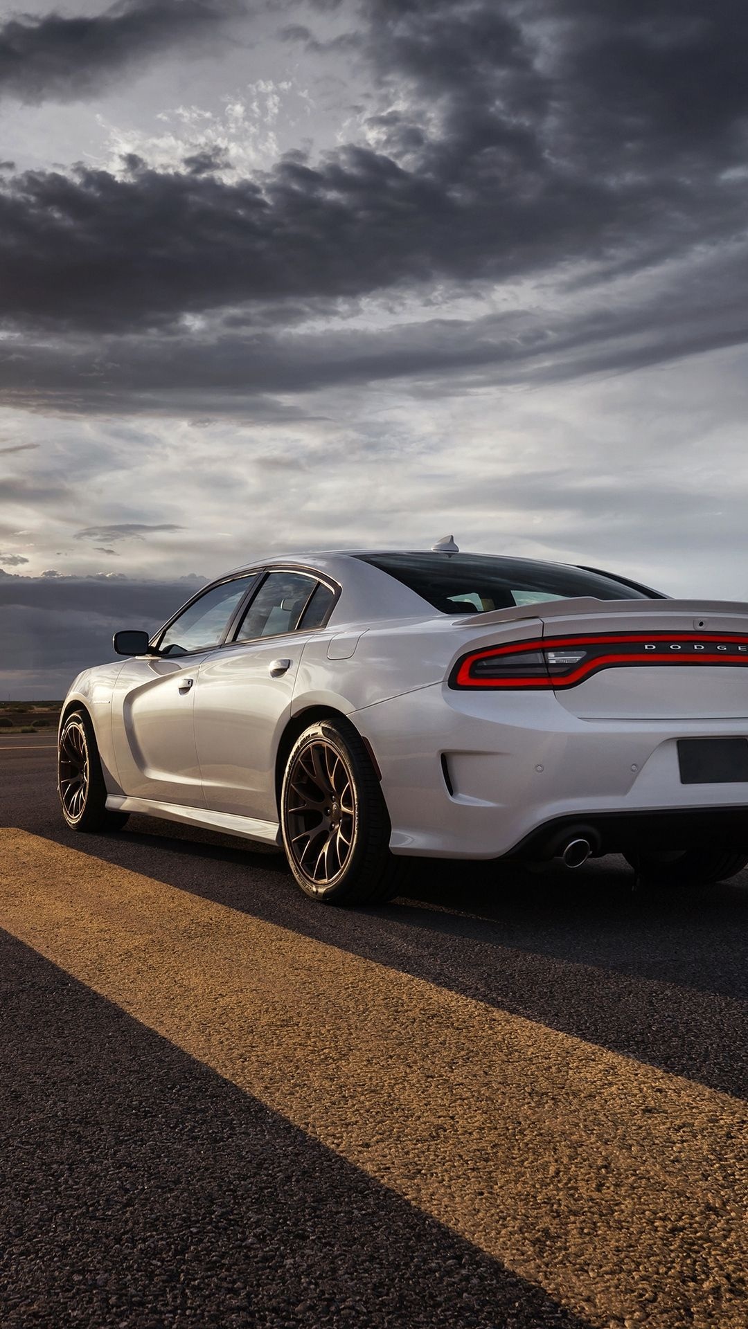Dodge Charger SRT Hellcat, asphalt road yellow line, dramatic overcast sky, Full HD Phone wallpaper