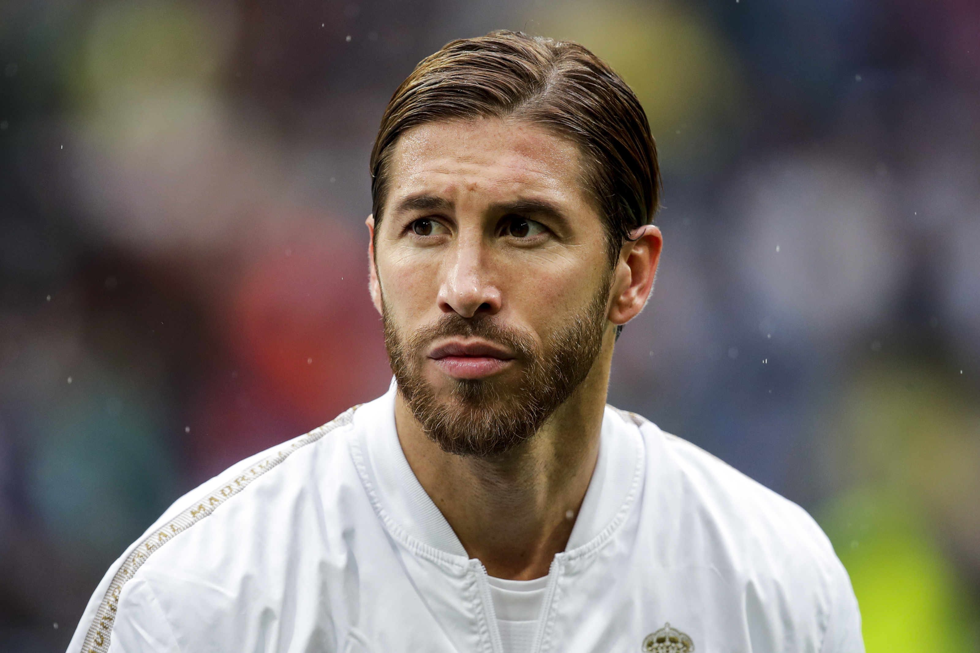 Sergio Ramos, Real Madrid CF jacket, blurred football stadium, HD Desktop wallpaper