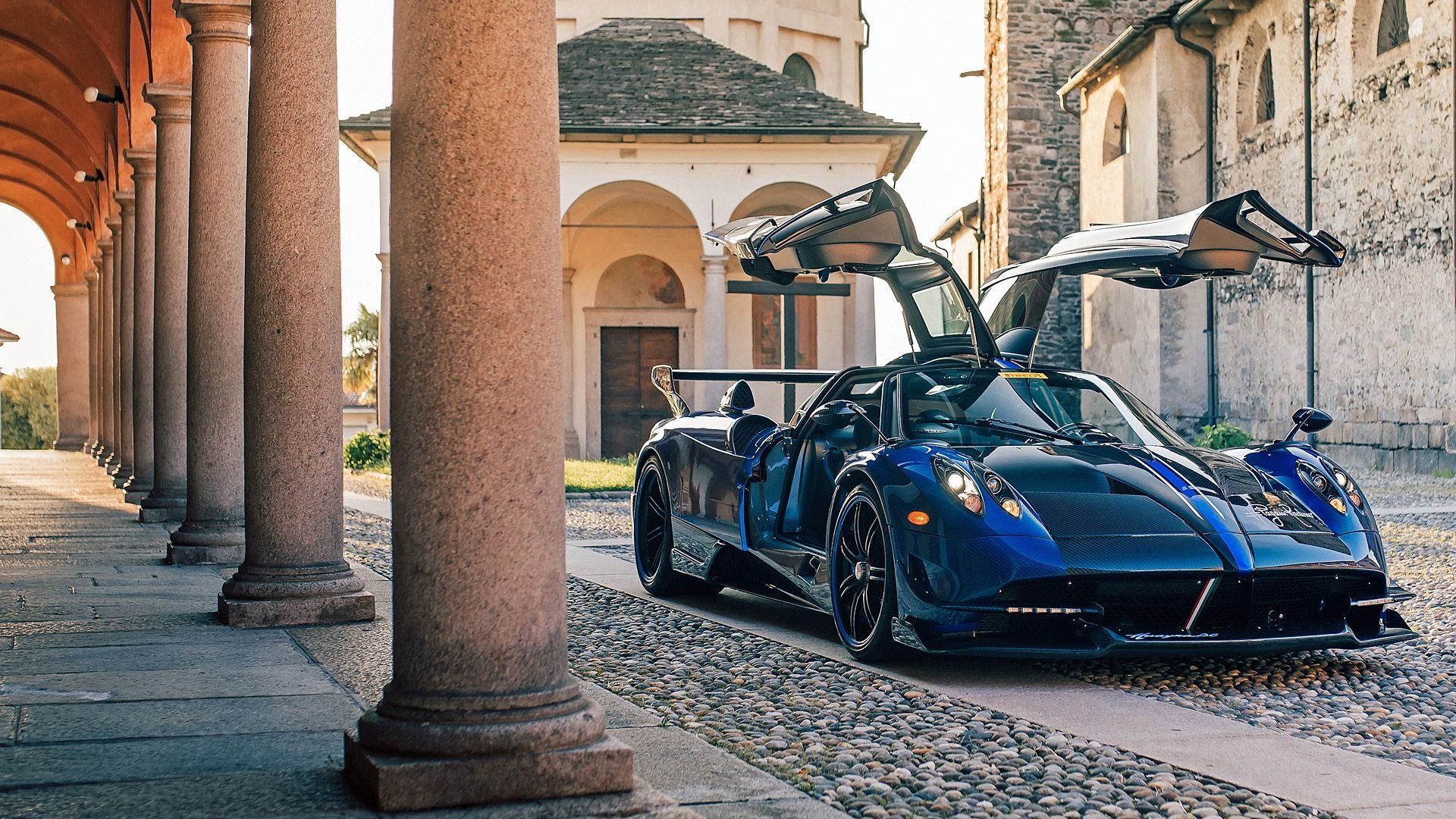 Pagani Huayra BC, Open gullwing doors, Cobblestone colonnade courtyard, Full HD Desktop wallpaper