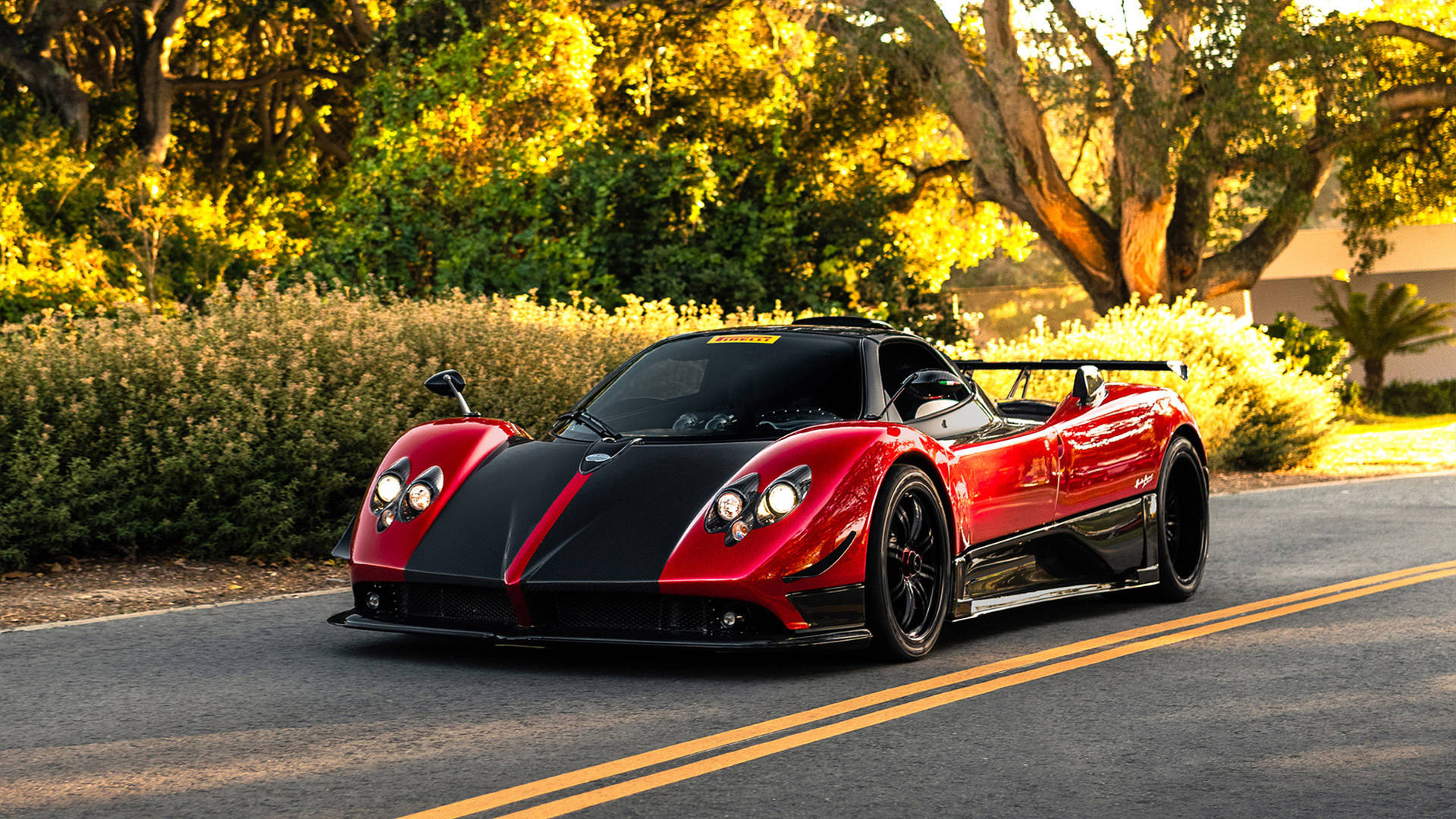 Pagani Zonda Cinque, sunlit asphalt road, golden hour trees, Full HD Desktop wallpaper