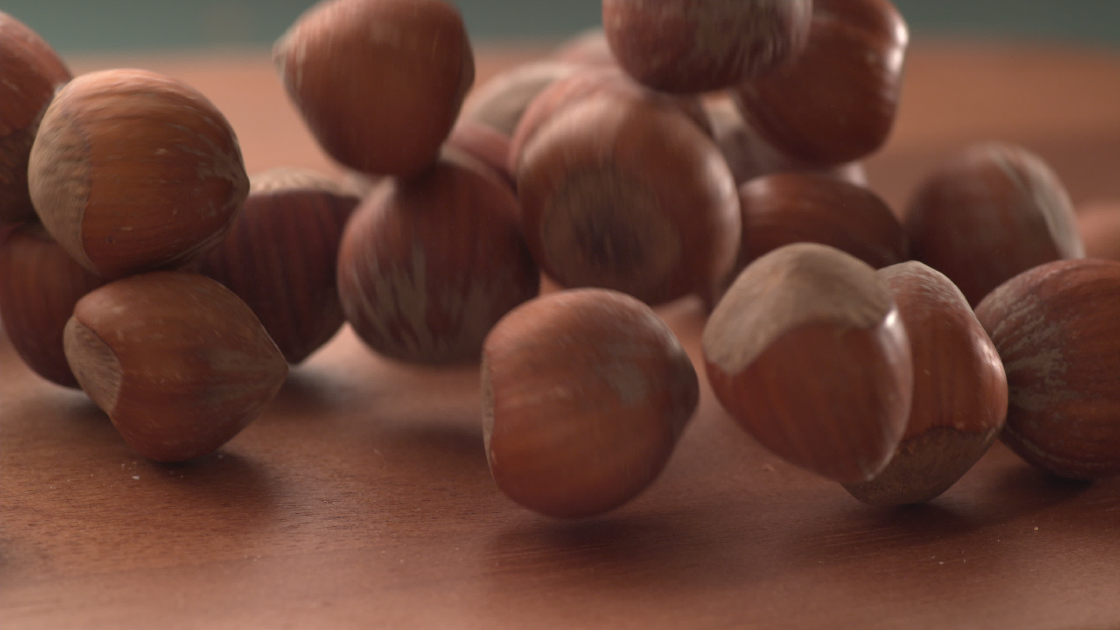 Slow motion video, Falling hazelnuts, Wooden surface, High-speed capture, 3840x2160 4K Desktop