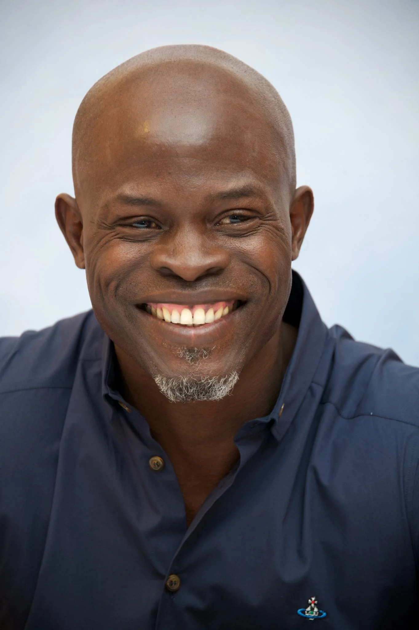 Djimon Hounsou, Handsome black actor, Eye-catching appearance, Charismatic presence, 1370x2050 HD Phone