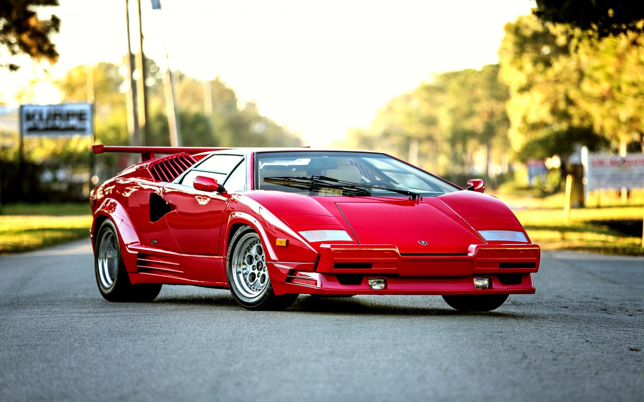 Lamborghini Countach 25th Anniversary, sunlit asphalt road, rear wing spoiler, HD Desktop wallpaper