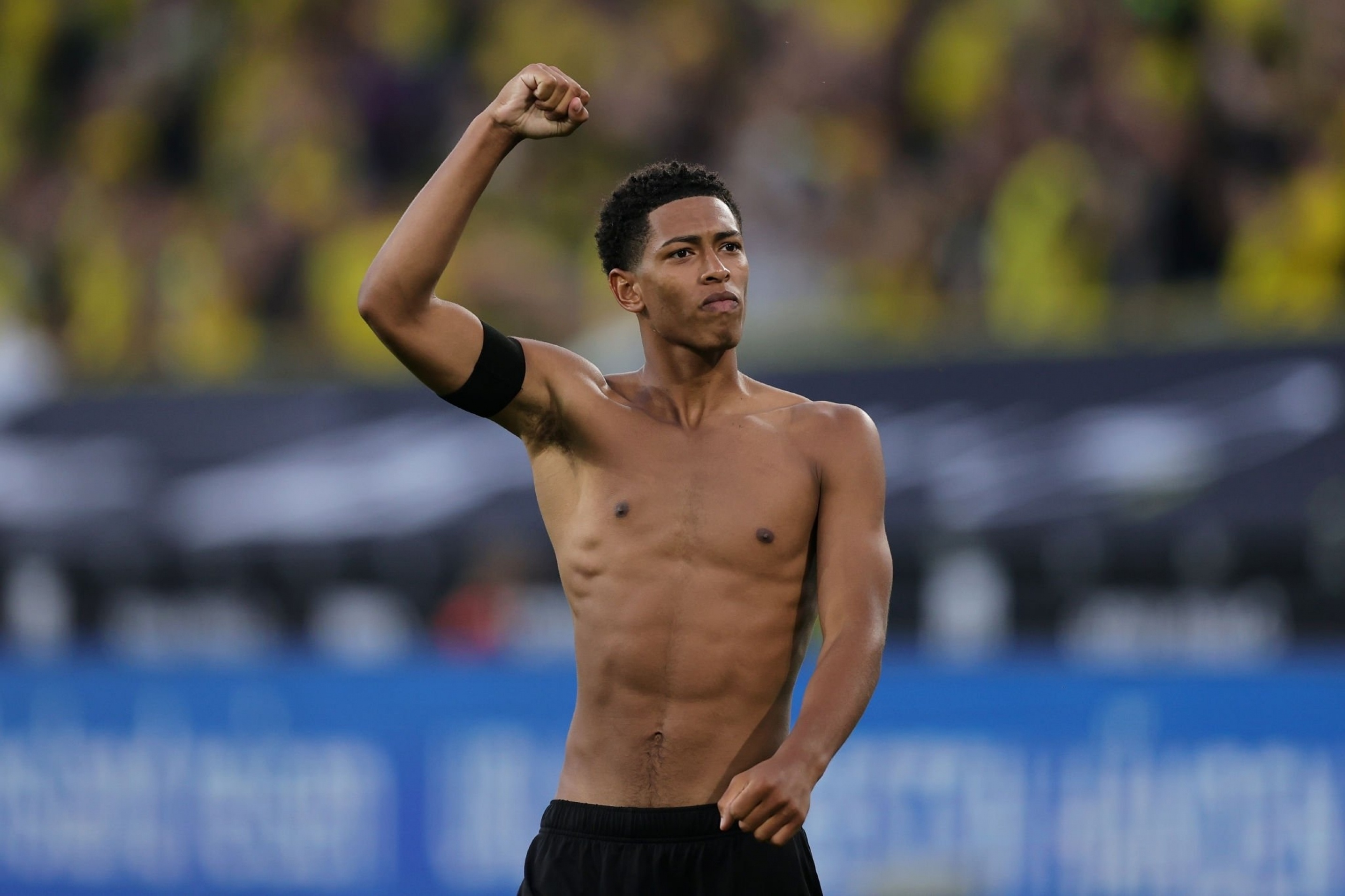 Jude Bellingham, Shirtless fist pump celebration, Borussia Dortmund crowd, HD Desktop wallpaper