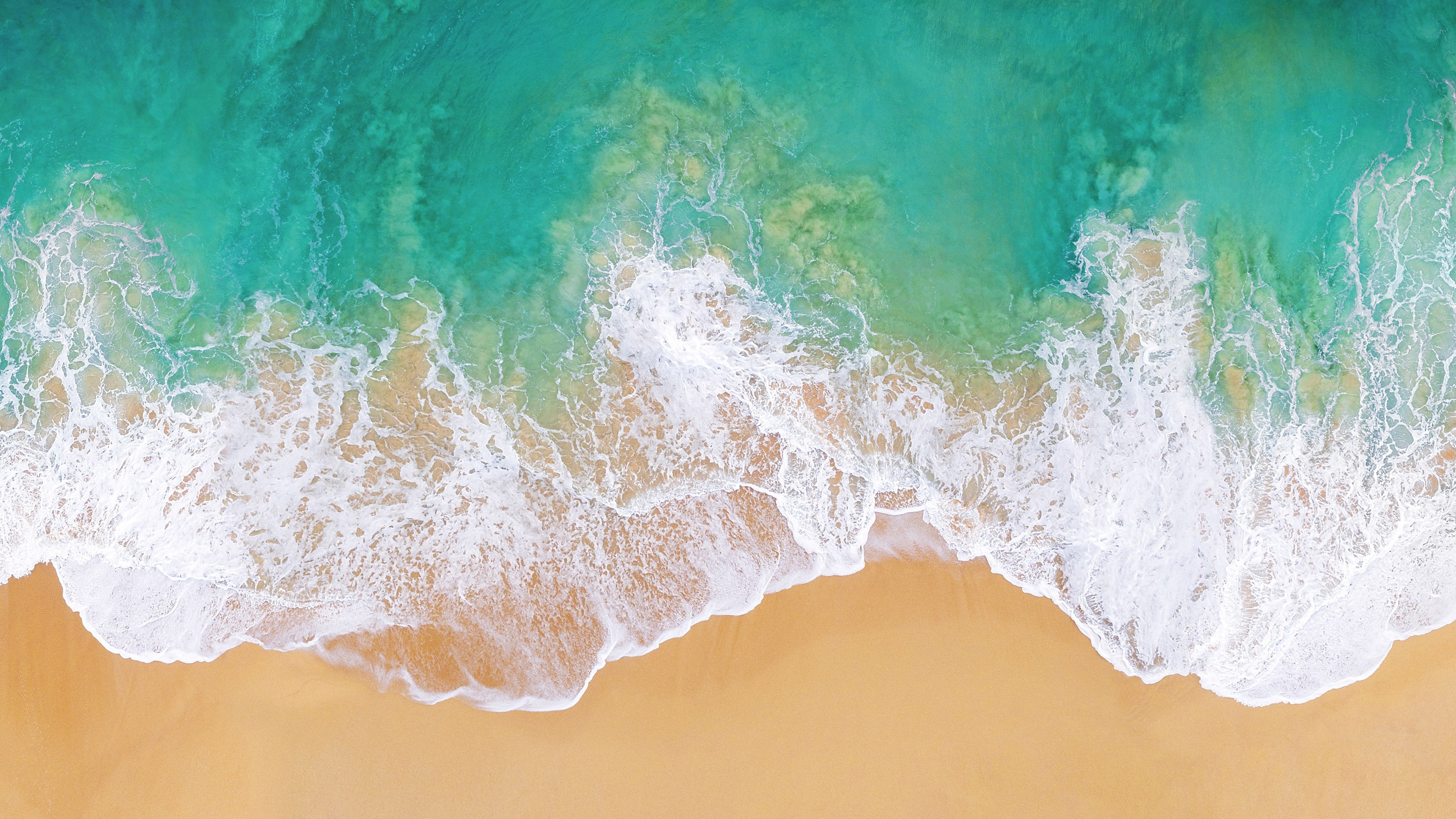 iOS 11 beach, turquoise ocean surf, golden sand shoreline, 4K Desktop wallpaper