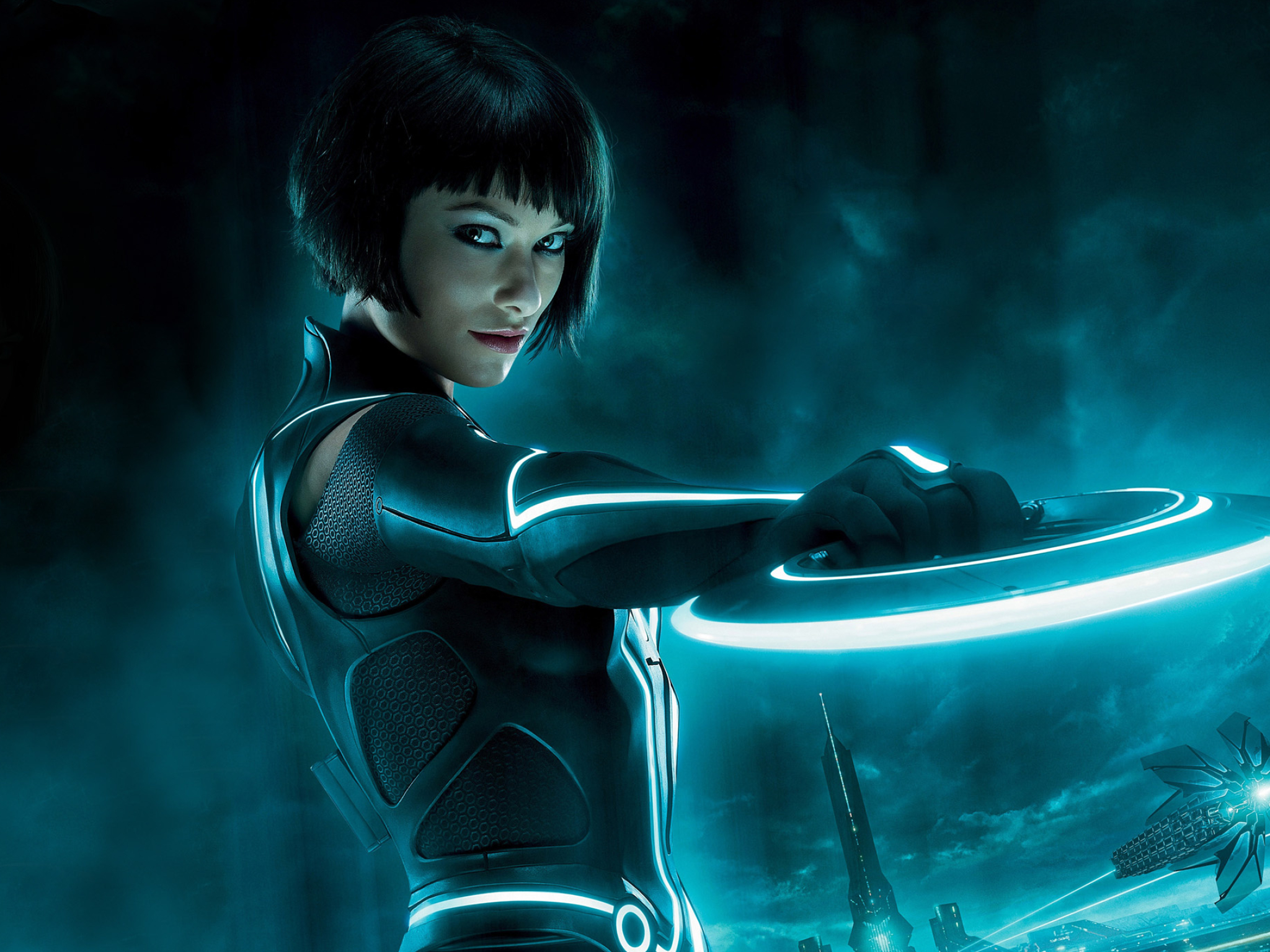 Olivia Wilde as Quorra, Glowing Tron Identity Disc, Tron: Legacy Grid cityscape, HD Desktop wallpaper