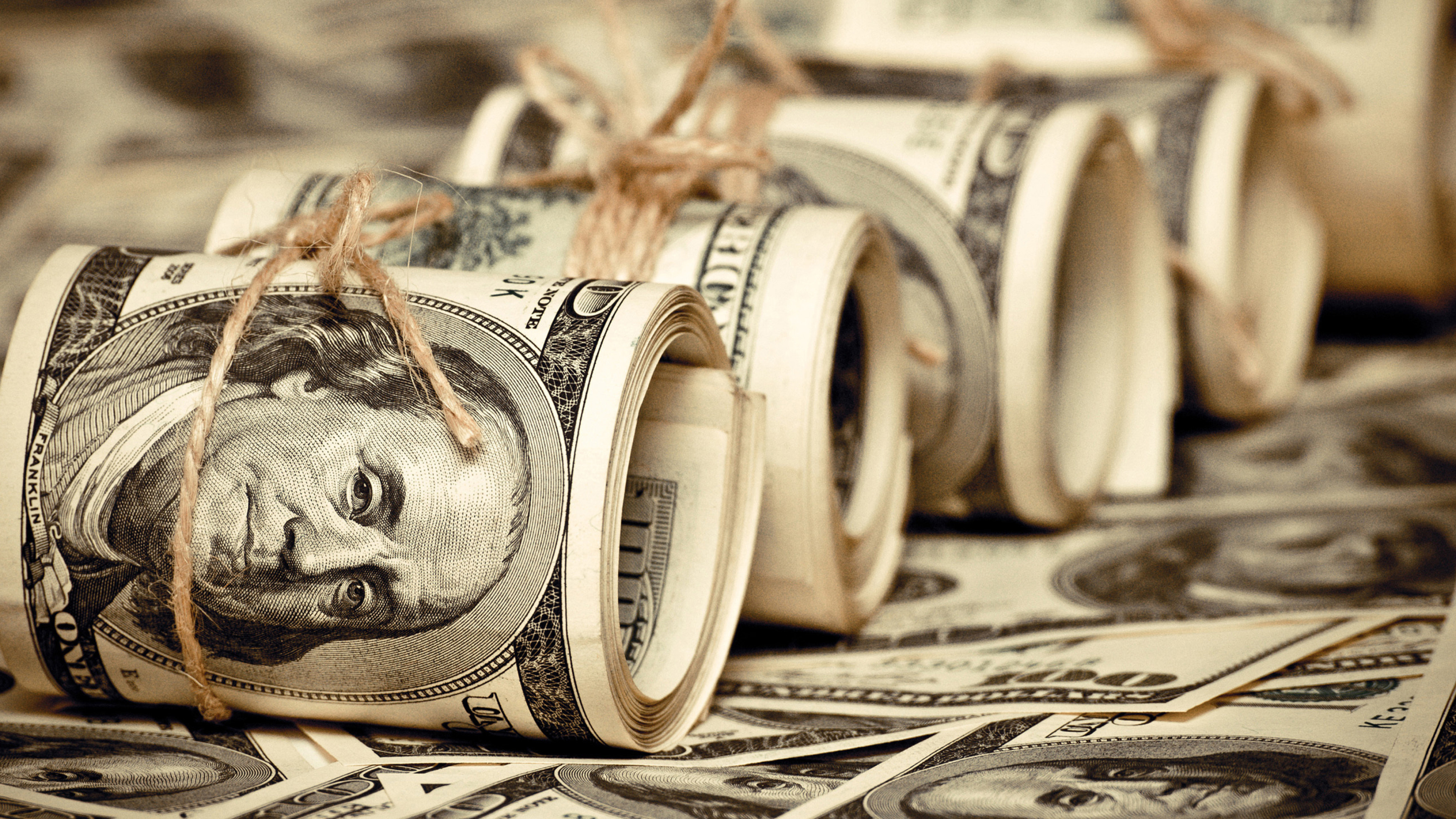 Rolled hundred-dollar bills, Benjamin Franklin portrait, Jute twine ties, 4K Desktop wallpaper