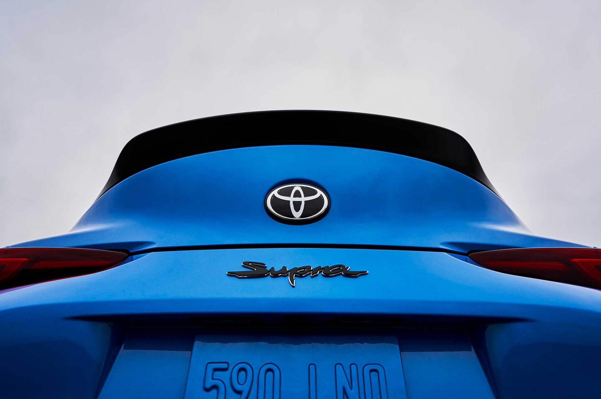 Toyota GR Supra rear, Toyota logo emblem, Blue ducktail spoiler, HD Desktop wallpaper