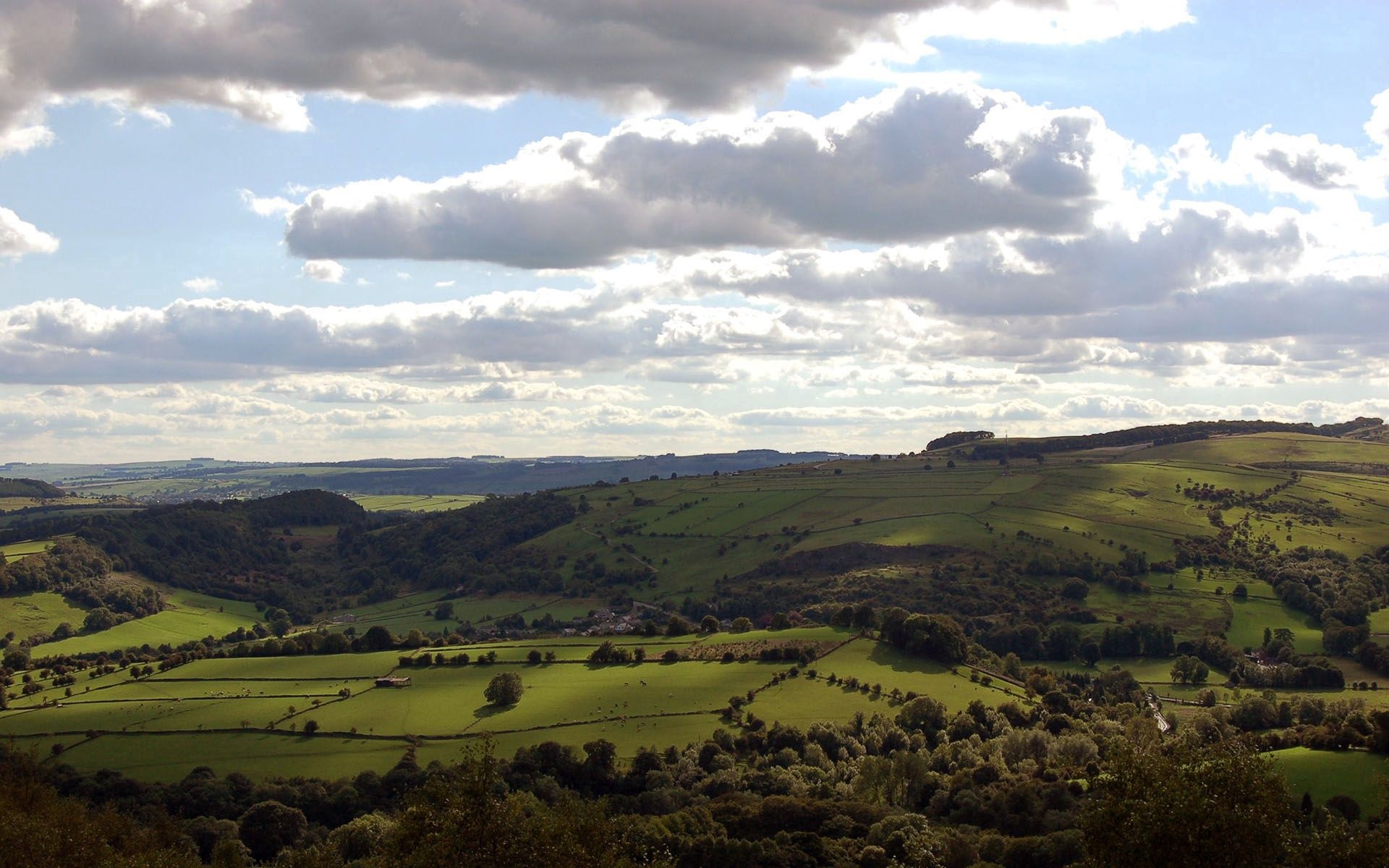 rolling green hills, patchwork agricultural pastures, scattered cumulus clouds, HD Desktop wallpaper