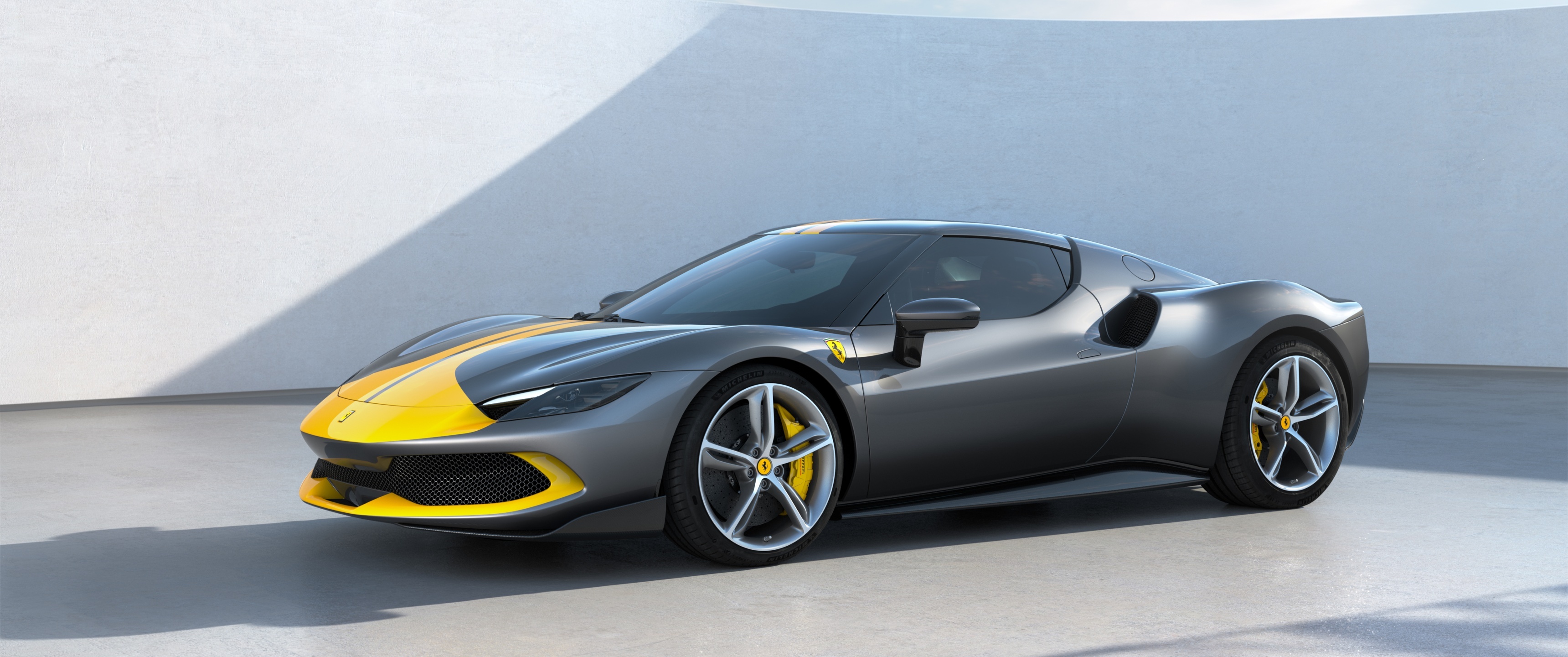 Ferrari 296 GTB Assetto Fiorano, yellow racing livery, minimalist studio showroom, Dual Screen Desktop wallpaper