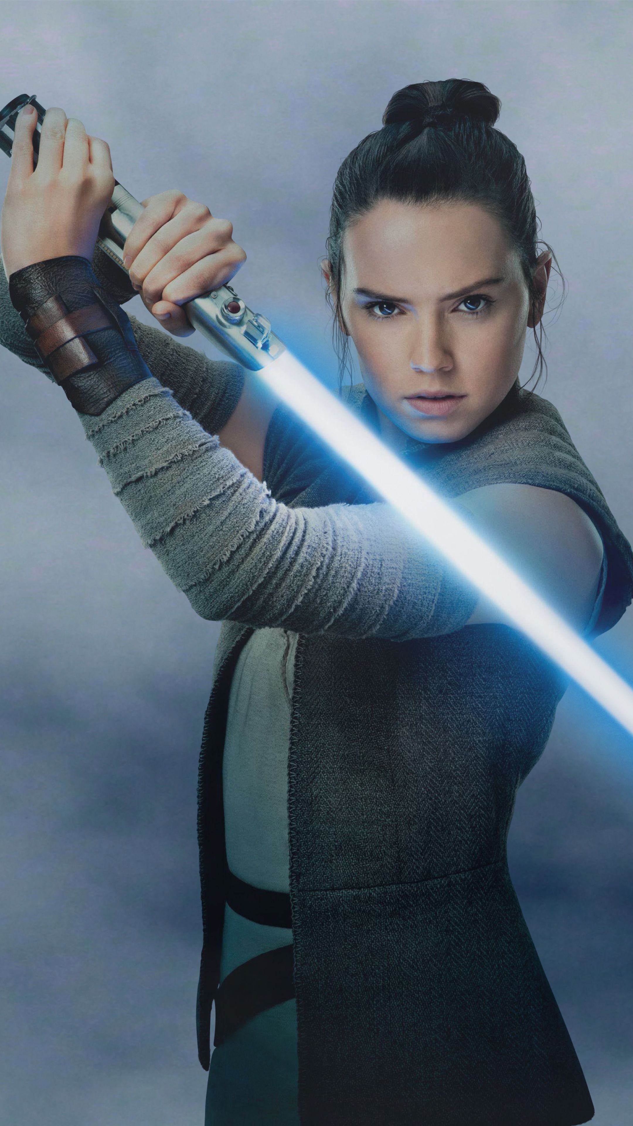 Daisy Ridley as Rey, Star Wars heroine, Lightsaber wielder, Intense movie moments, 2160x3840 4K Phone