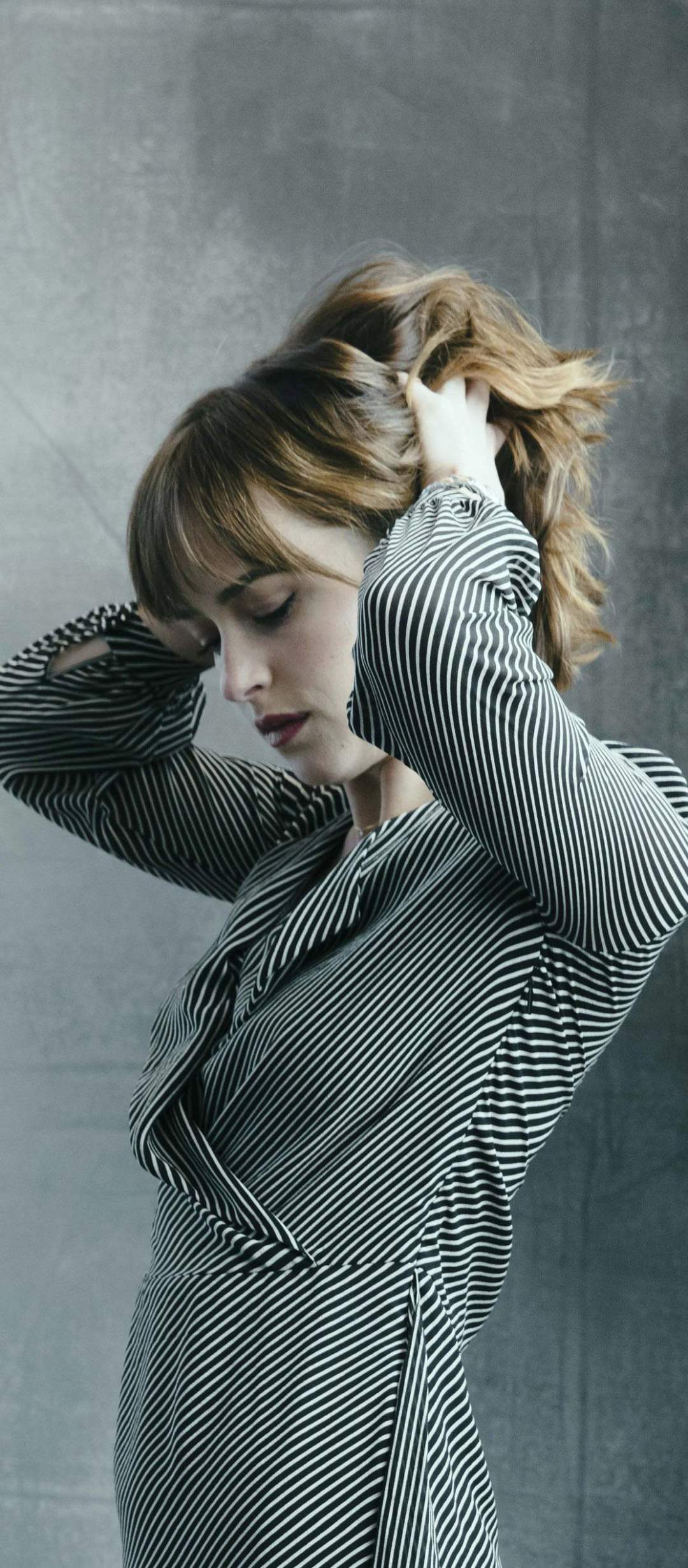 Dakota Johnson, Celebrity appeal, Fashionable captures, Photogenic beauty, 1080x2460 HD Phone