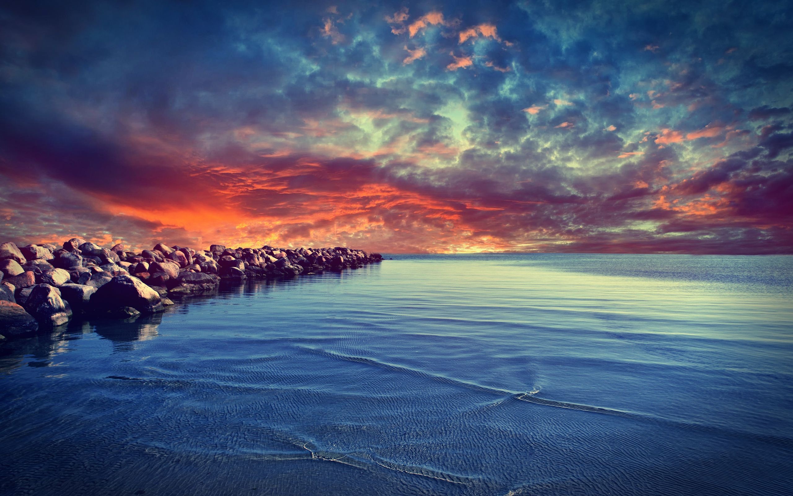 rocky breakwater jetty, calm rippled sea, dramatic dusk sky, HD Desktop wallpaper