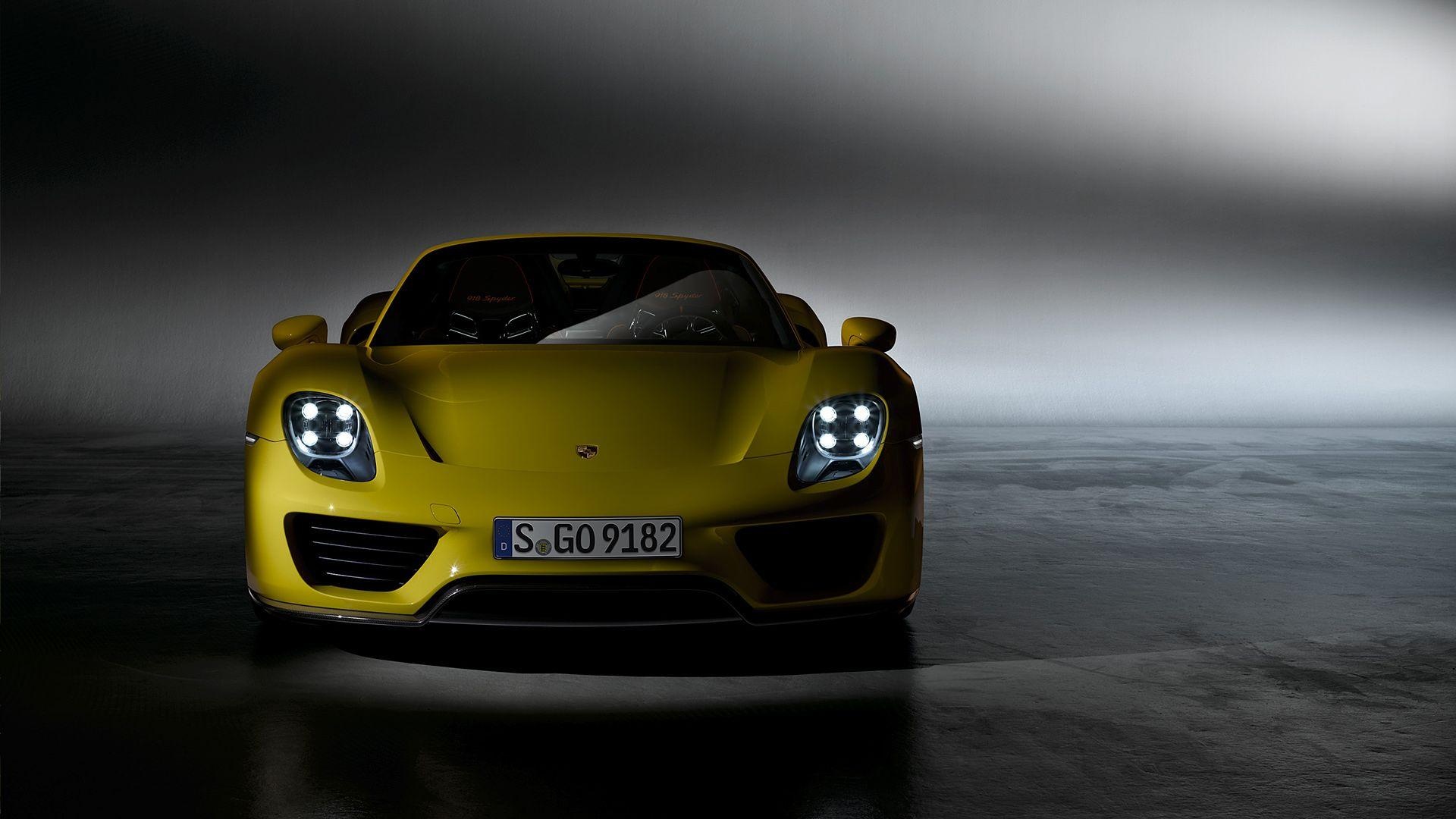 Yellow Porsche 918 Spyder, Illuminated quad LED headlights, Dark studio setting, Full HD Desktop wallpaper