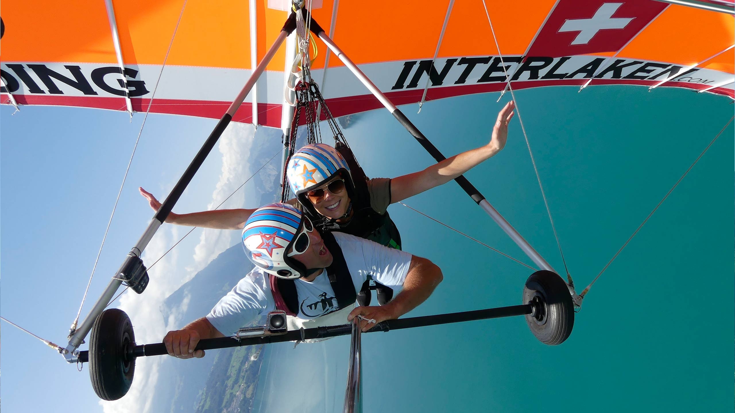 Hang gliding in Interlaken, Swiss adventure, Stunning Alpine scenery, Thrilling aerial experience, 2560x1440 HD Desktop