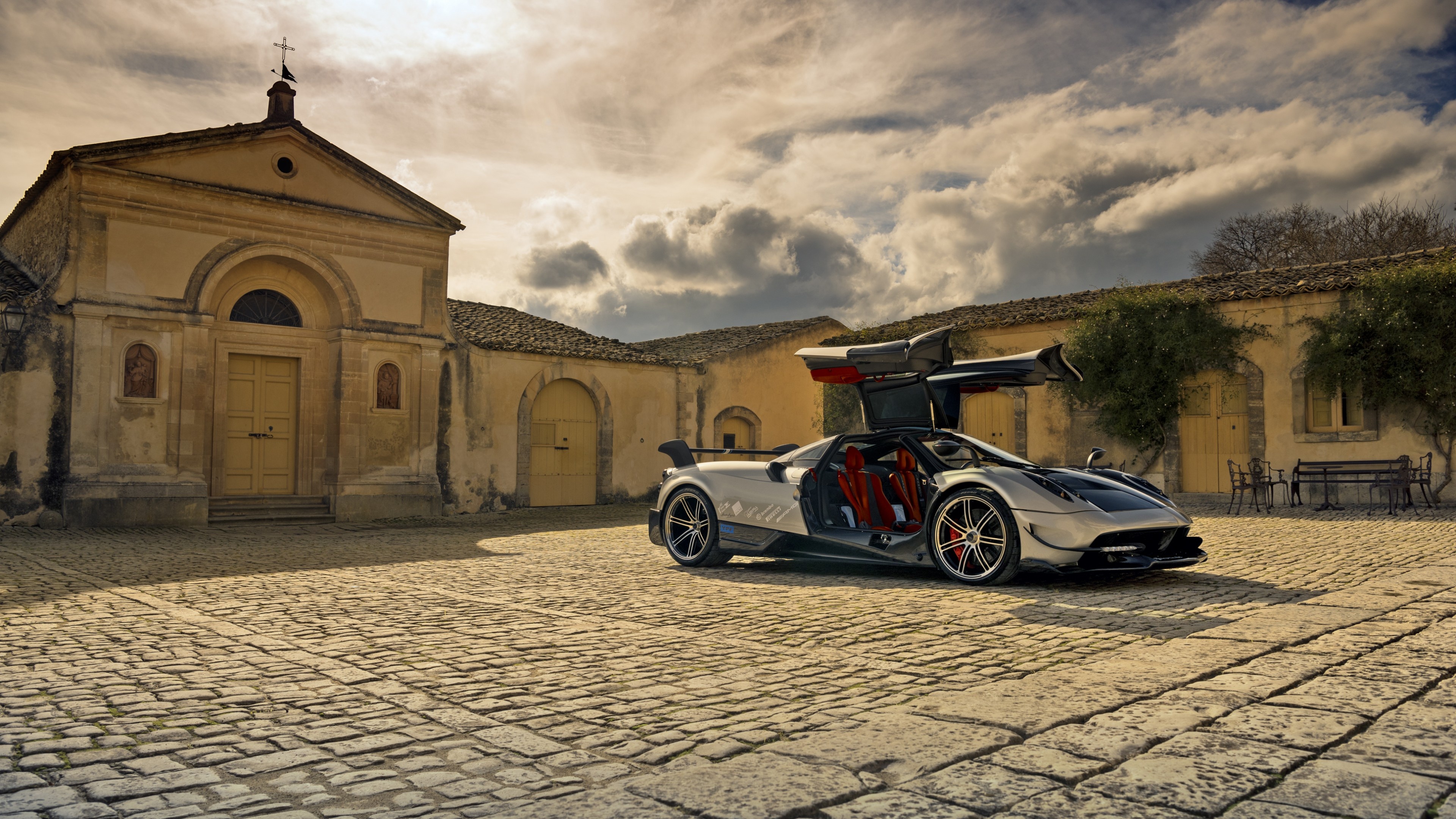 Pagani Huayra BC, historic stone church, cobblestone courtyard, 4K Desktop wallpaper