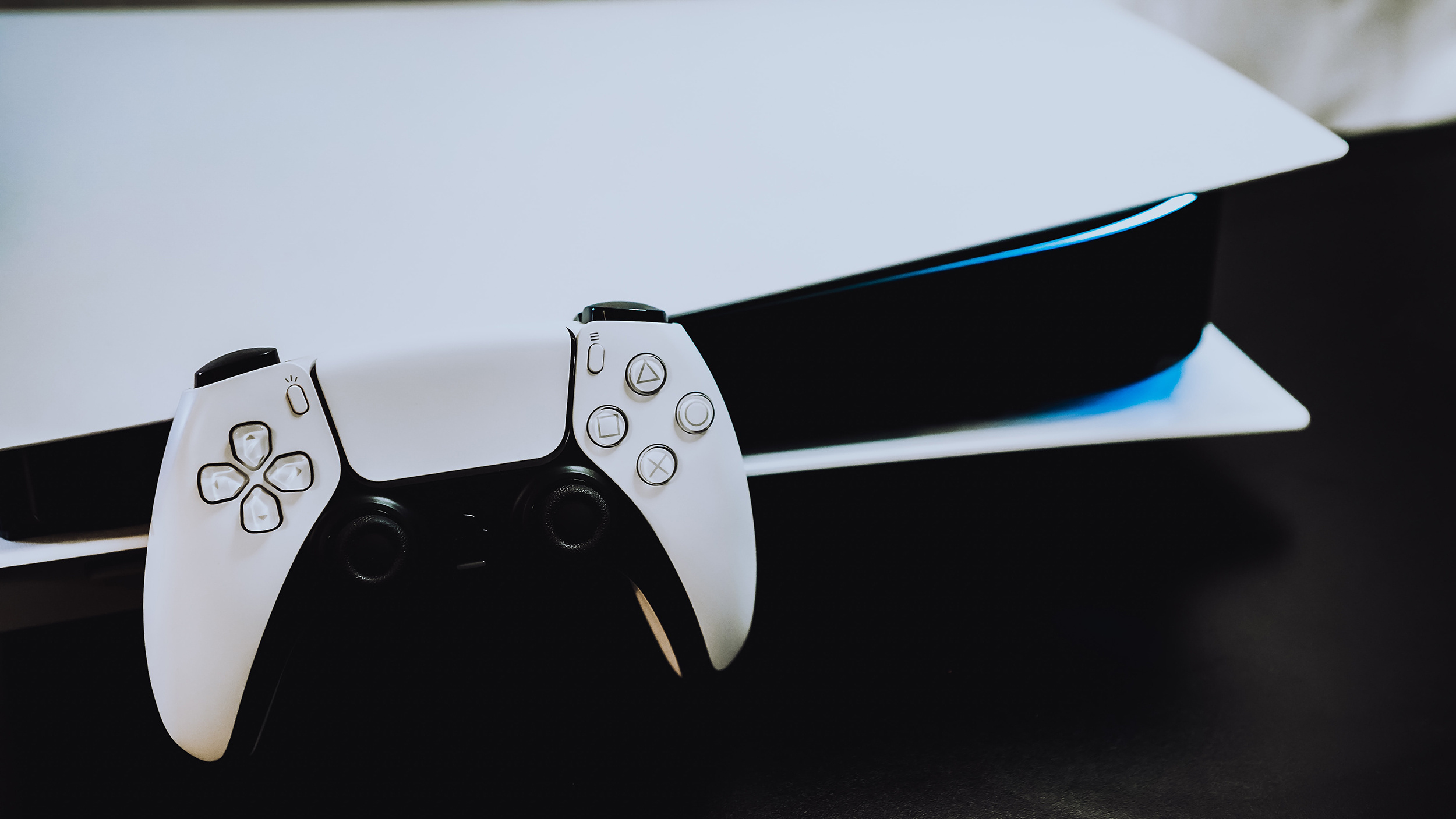 DualSense wireless controller, Horizontal PlayStation 5 console, Blue light strip glow, HD Desktop wallpaper