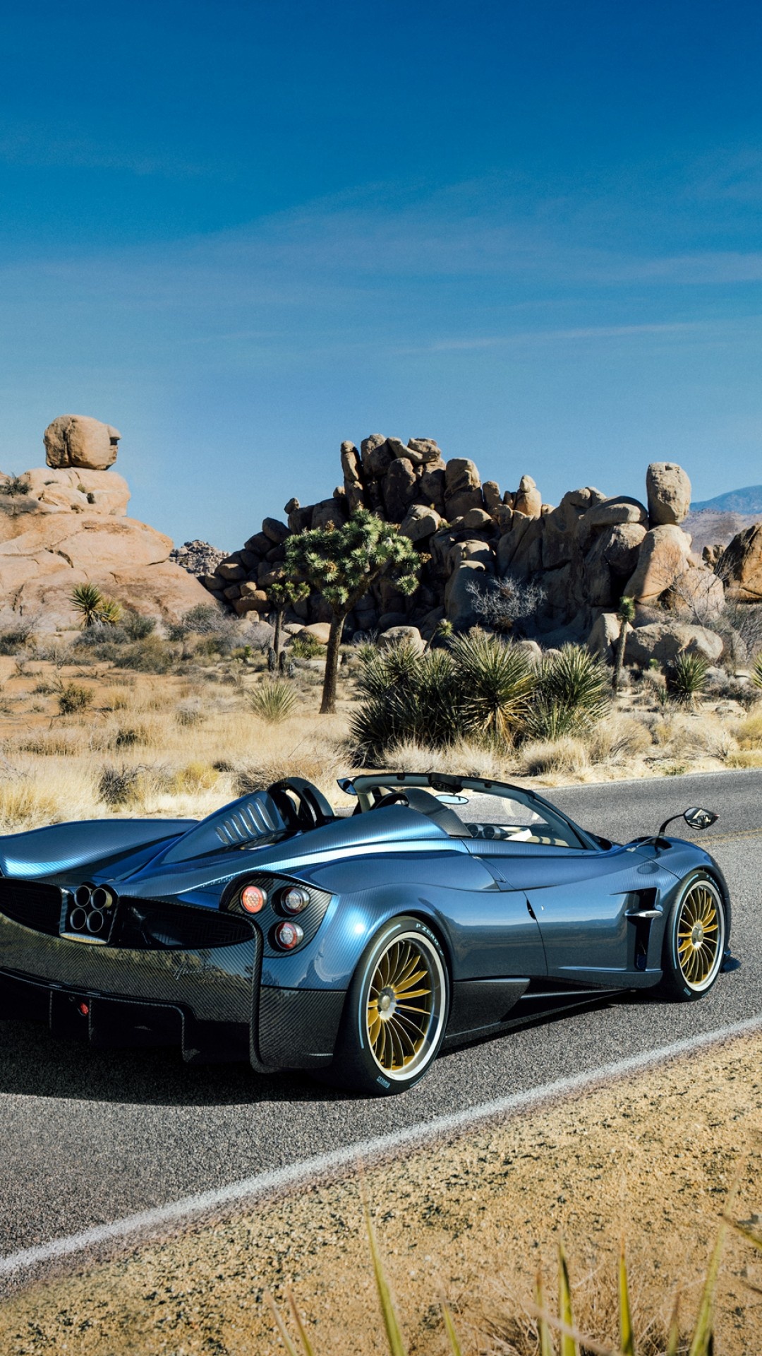 Pagani Huayra Roadster, Joshua Tree desert landscape, gold multi-spoke wheels, Full HD Phone wallpaper