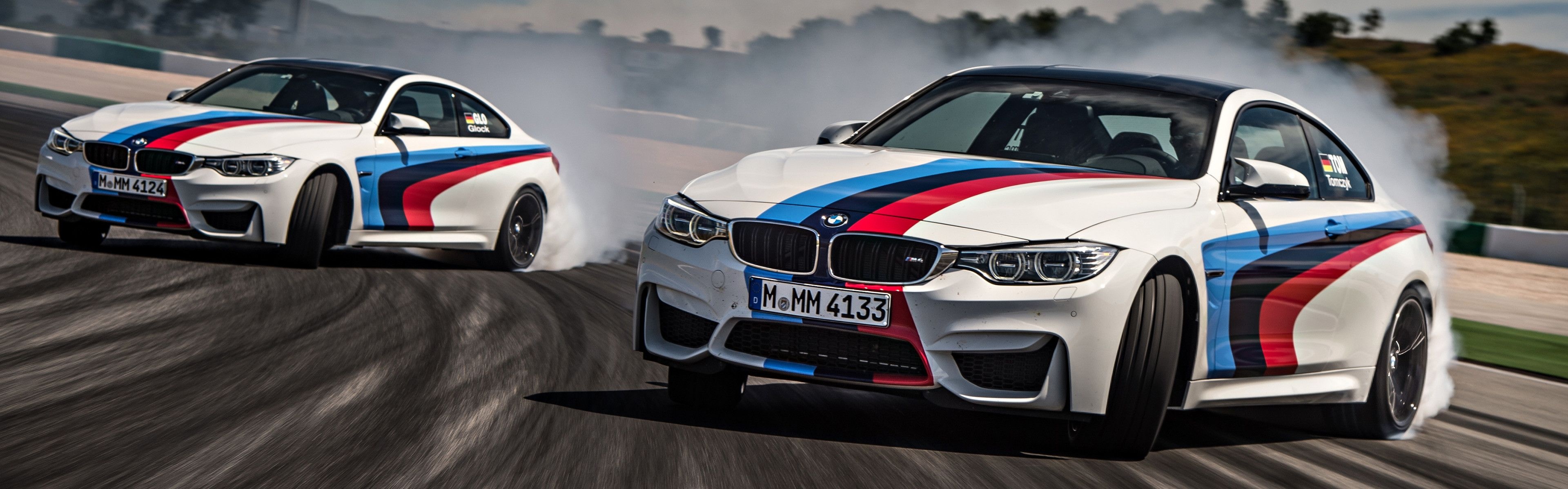 BMW M4 Coupe, BMW M Motorsport livery, Racetrack tire smoke drift, Dual Screen Desktop wallpaper