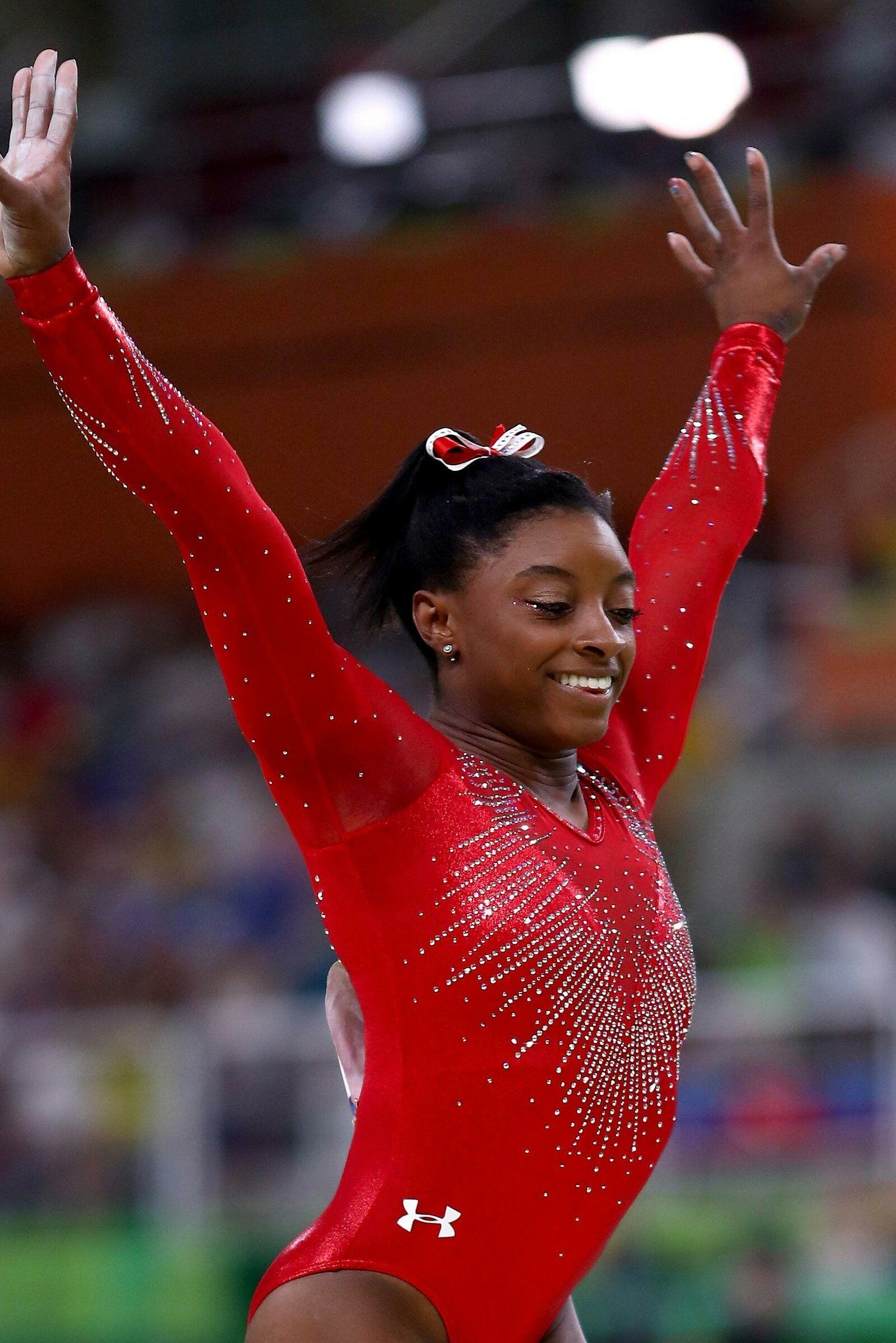 Simone Biles, Striking wallpapers, Gymnastics greatness, Iconic images, 1600x2400 HD Phone