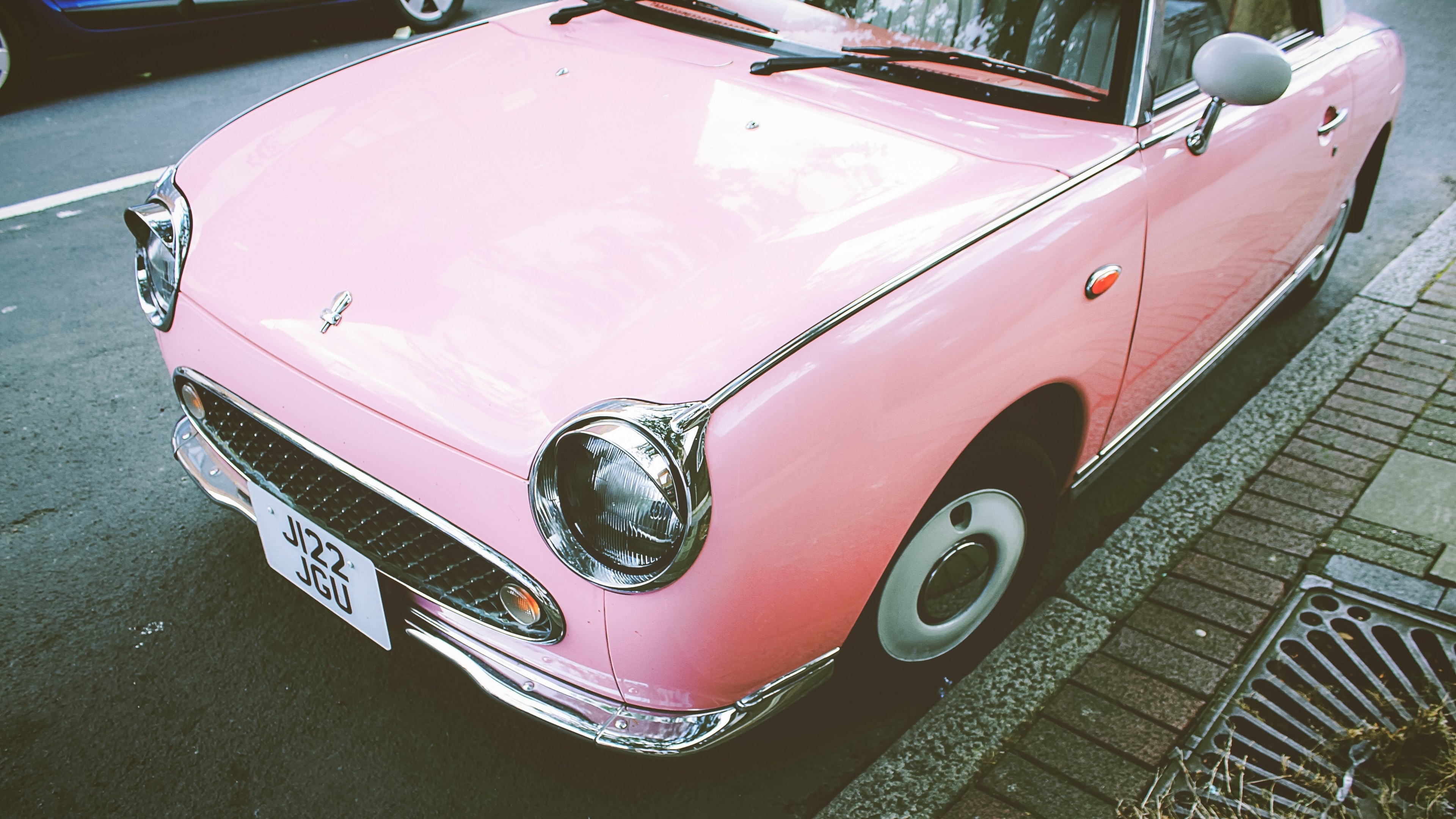 pink Nissan Figaro, J122 JGU license plate, paved roadside curb, 4K Desktop wallpaper