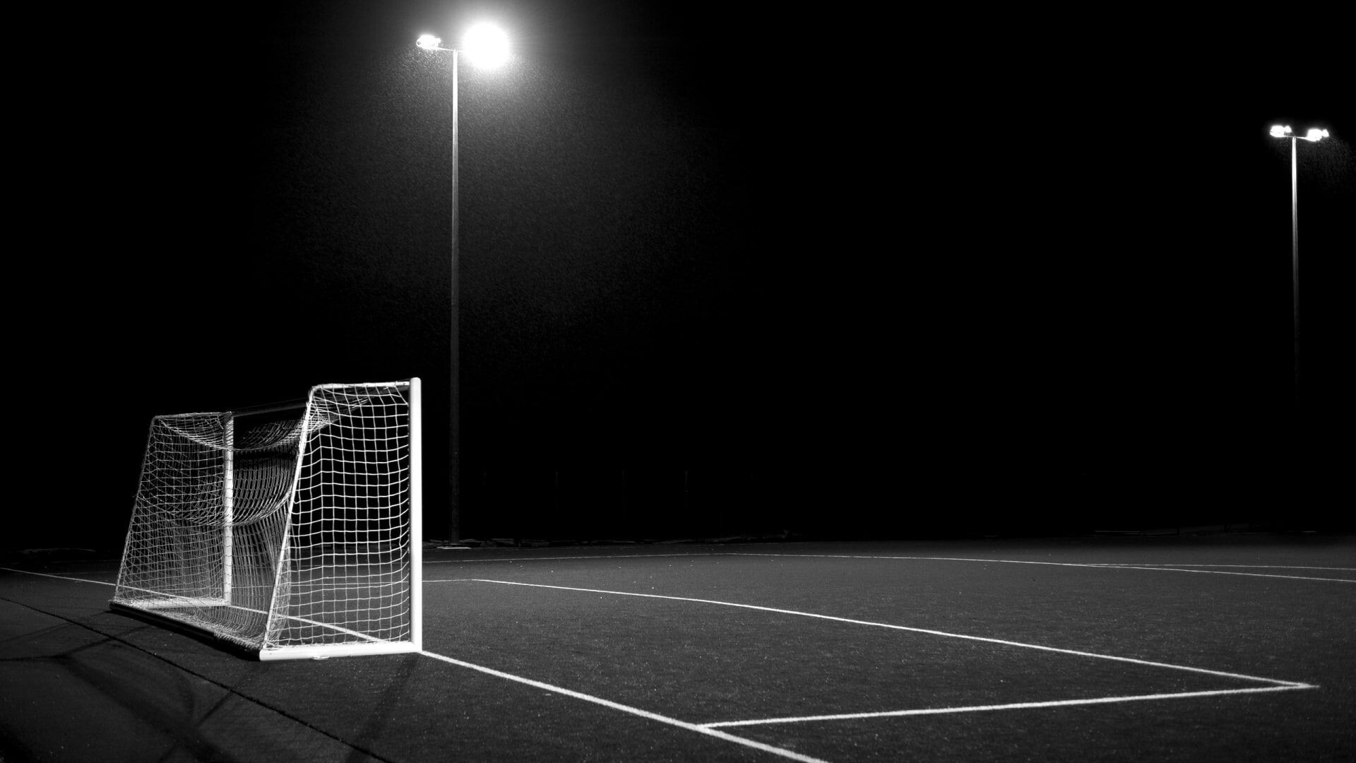 Sports football field night light, Soccer's allure, Grayscale beauty, Goalpost drama, 1920x1080 Full HD Desktop