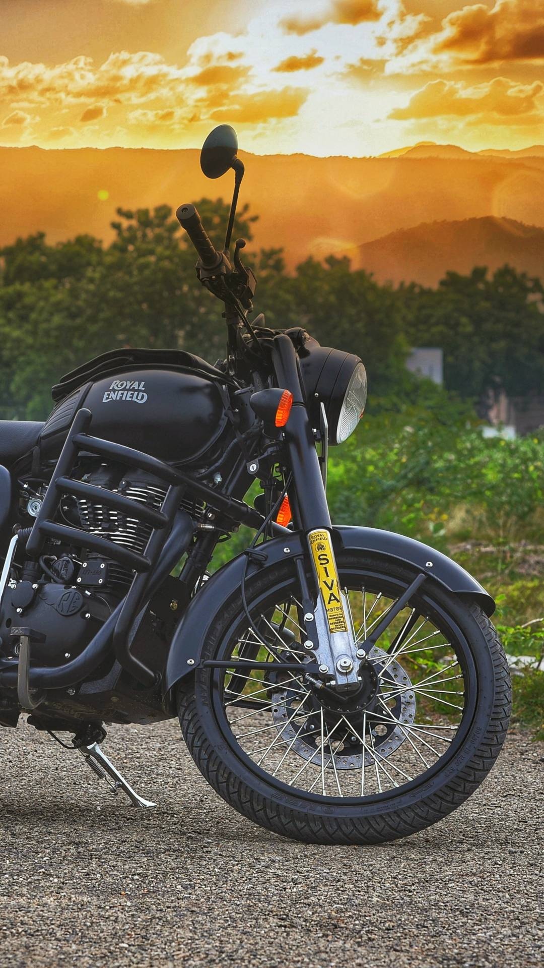 Royal Enfield Classic 350, golden sunset mountain landscape, front spoked motorcycle wheel, Full HD Phone wallpaper