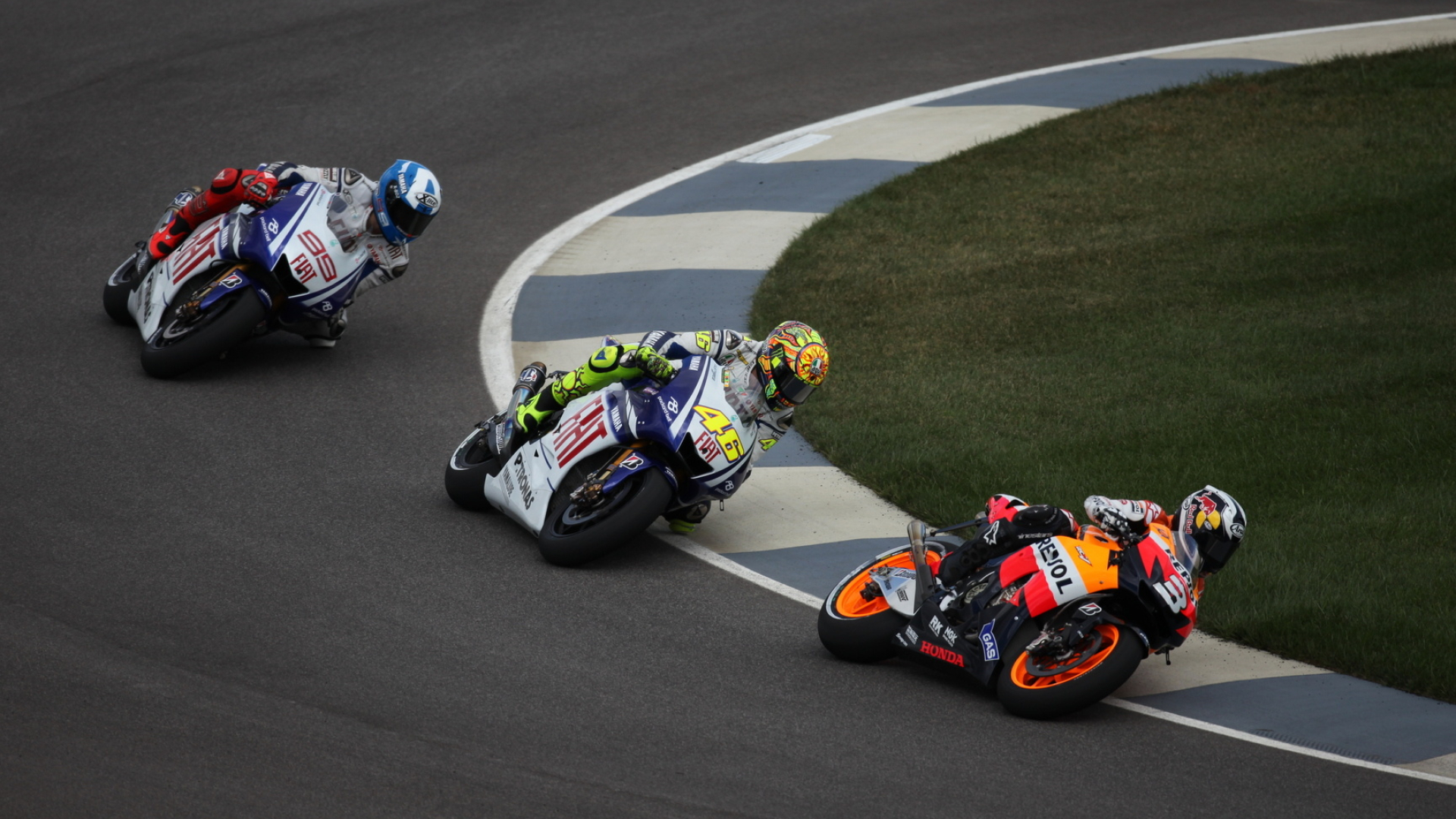 Valentino Rossi number 46, Jorge Lorenzo number 99, Fiat Yamaha YZR-M1 pair, Repsol Honda leading trio, MotoGP riders through corner, Full HD Desktop wallpaper