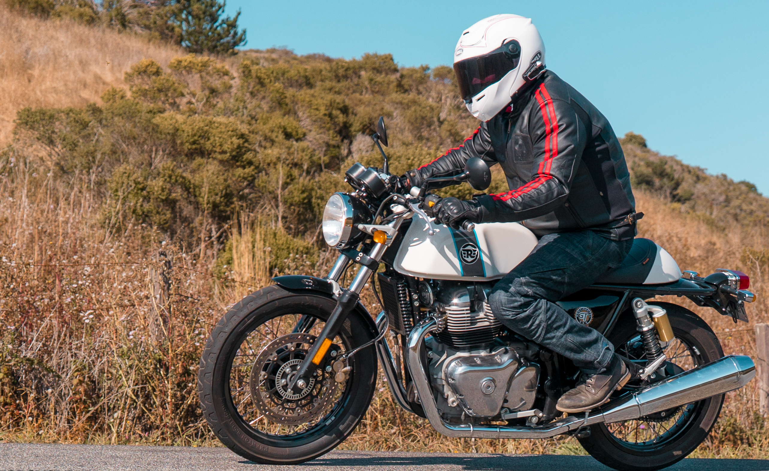 Royal Enfield Continental GT 650, Helmeted motorcycle rider, Grassy hillside roadside, HD Desktop wallpaper