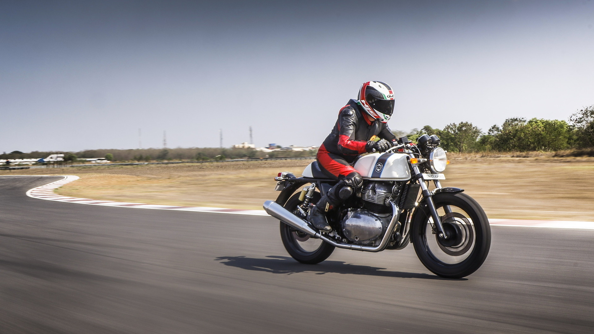 Royal Enfield Continental GT 650, Motorcyclist in leather suit, Asphalt racetrack curve, Full HD Desktop wallpaper