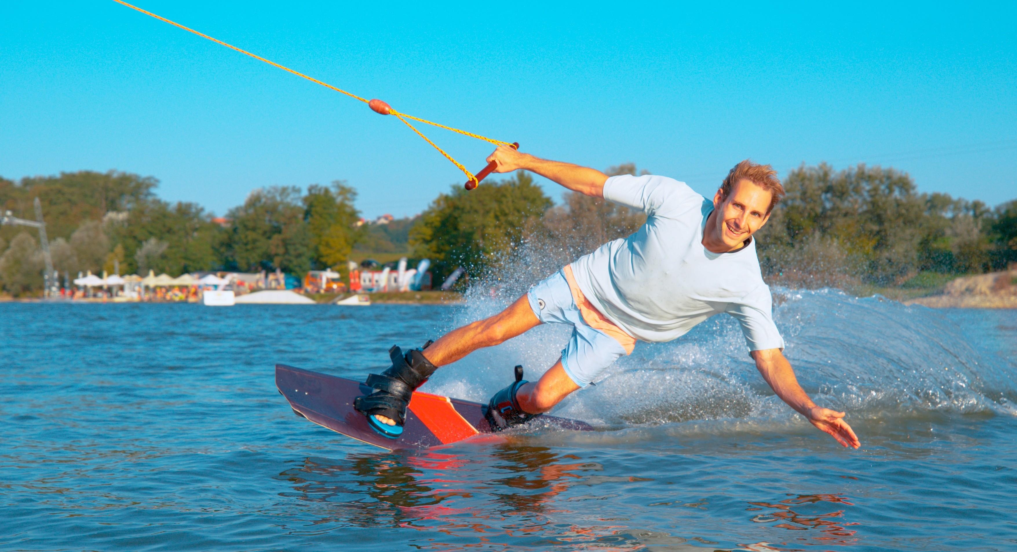 Beach wakeboarding, Greek coastline, Water sport thrill, Exhilarating waves, 3520x1910 HD Desktop