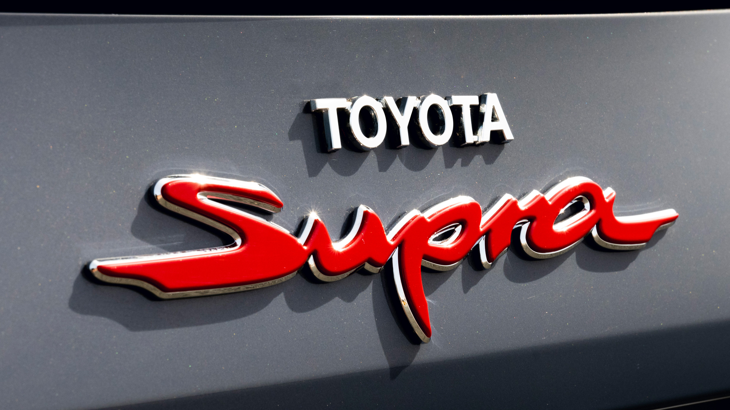 Toyota Supra badge, Red script Supra emblem, Chrome Toyota lettering, HD Desktop wallpaper