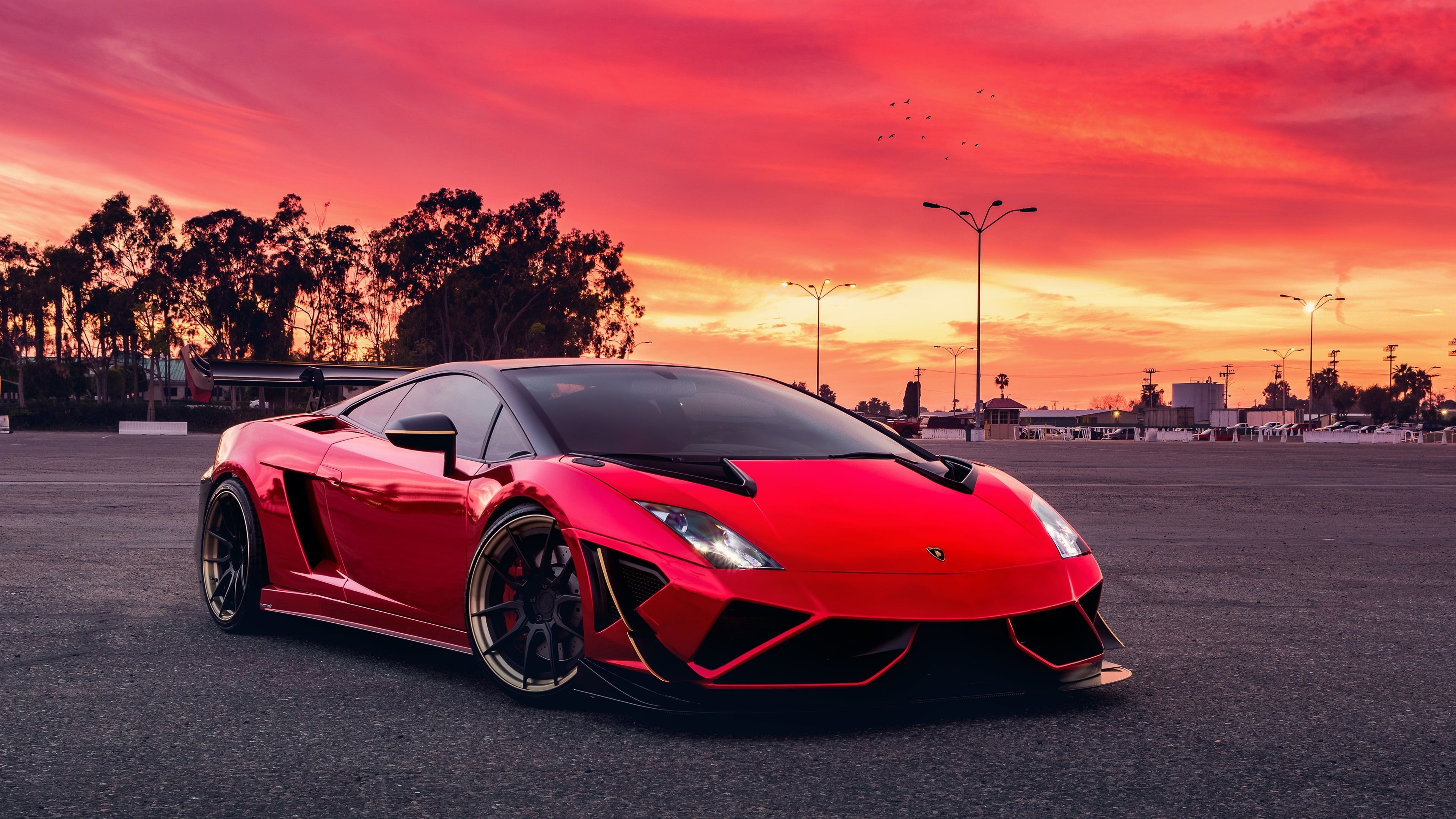 custom Lamborghini Gallardo, asphalt parking lot, vibrant red sunset sky, 4K Desktop wallpaper