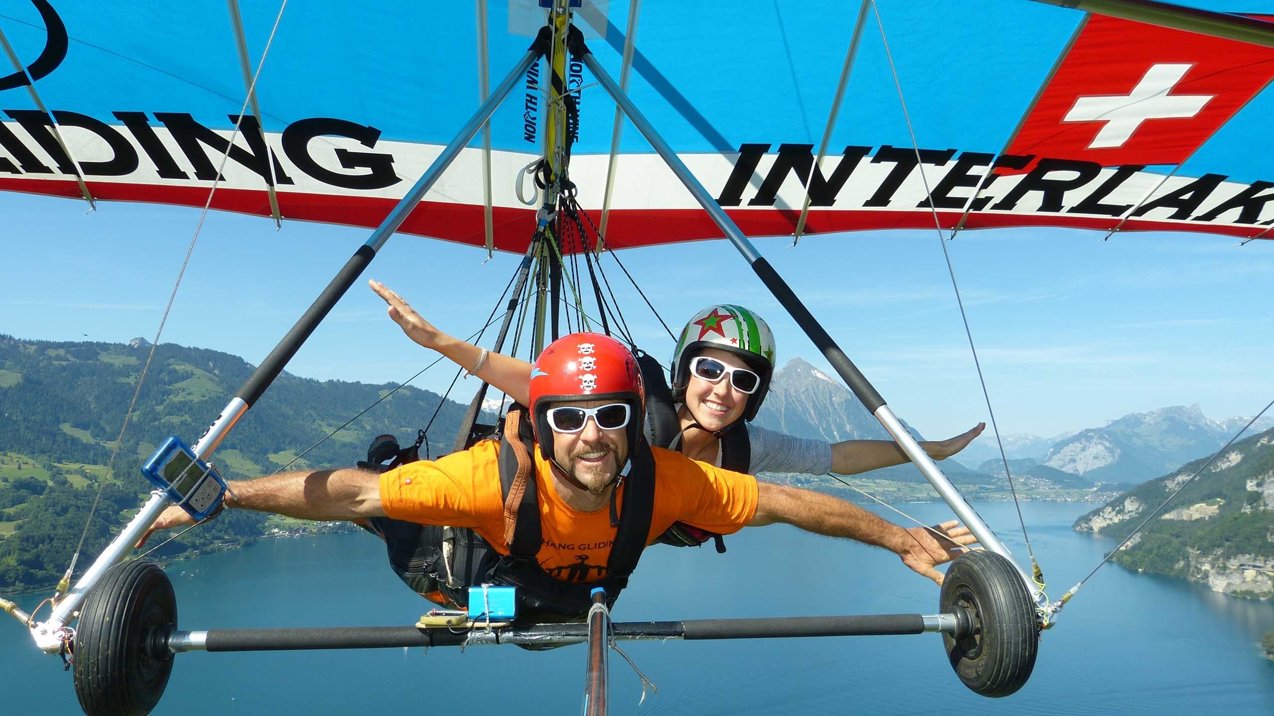 Hang gliding in Interlaken, Swiss adventure, Stunning Alpine scenery, Thrilling aerial experience, 2560x1440 HD Desktop