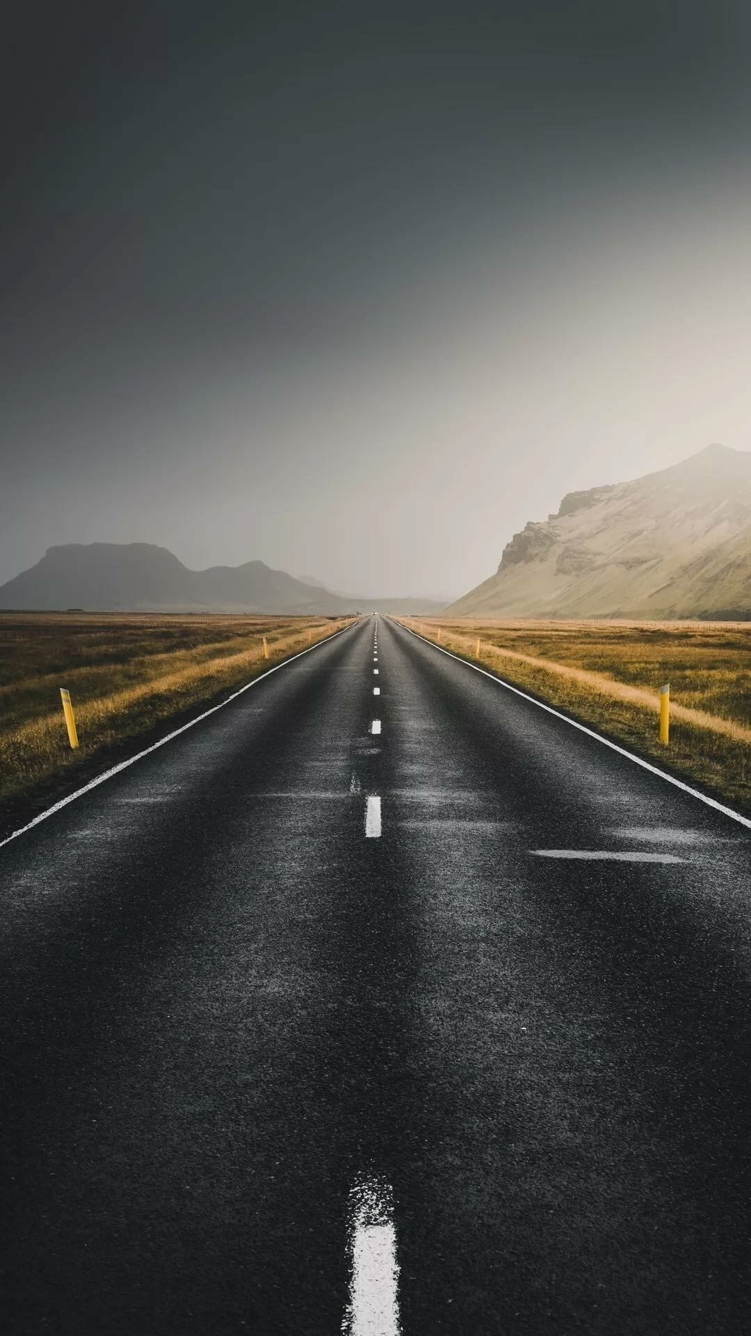 Iceland Ring Road, straight asphalt highway, yellow roadside marker posts, Full HD Phone wallpaper