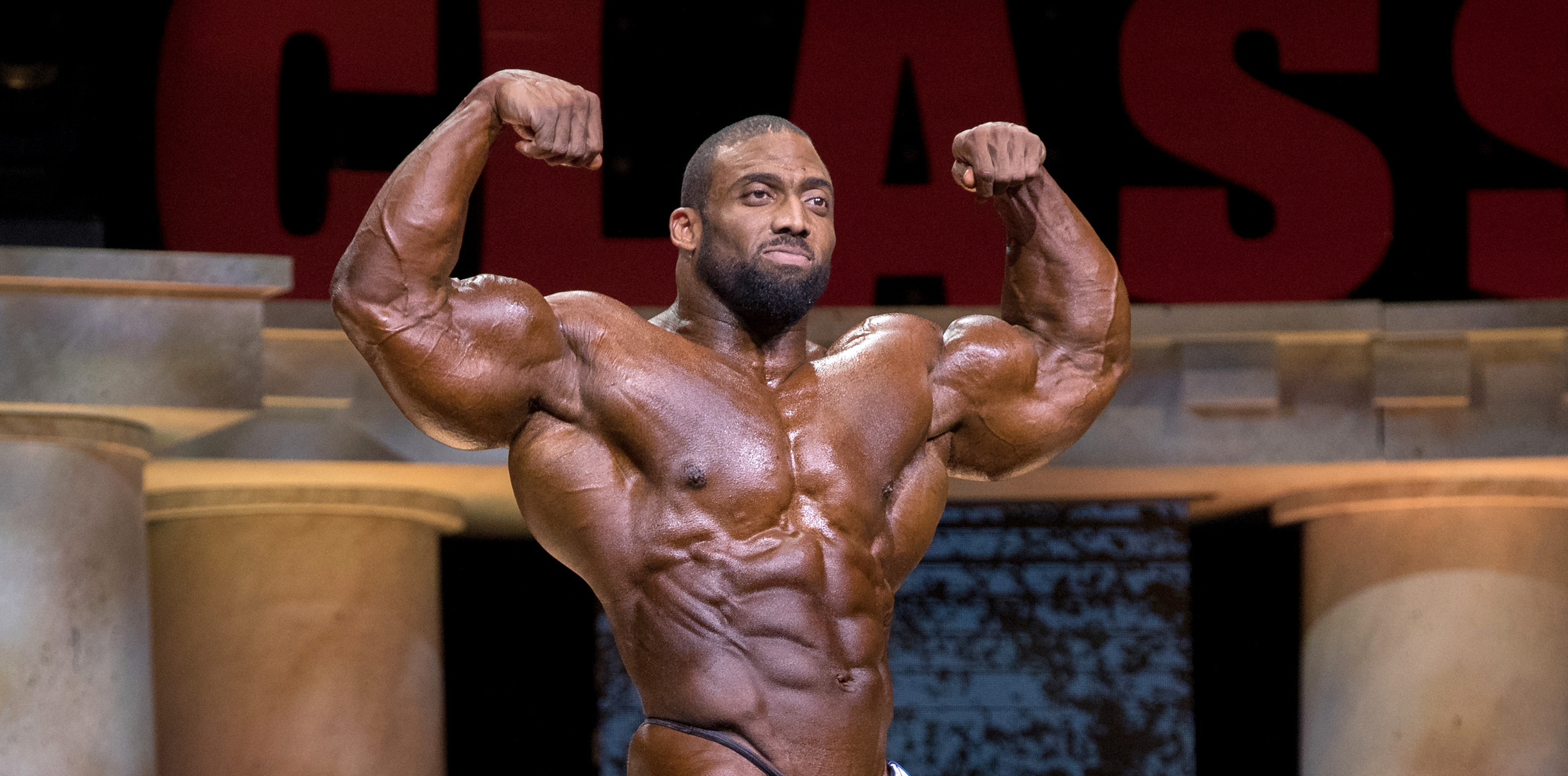 Cedric McMillan, Front double biceps pose, Arnold Classic stage, Dual Screen Desktop wallpaper