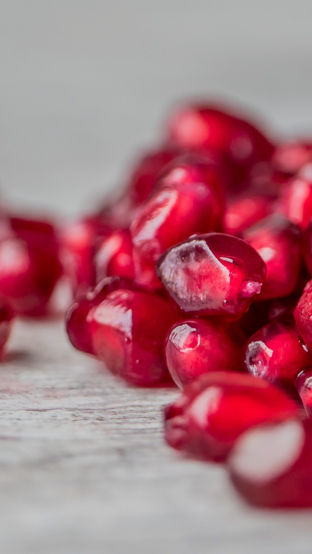 Pomegranate seeds, Vibrant background, Fresh produce, Nutritional benefits, 1080x1920 Full HD Phone