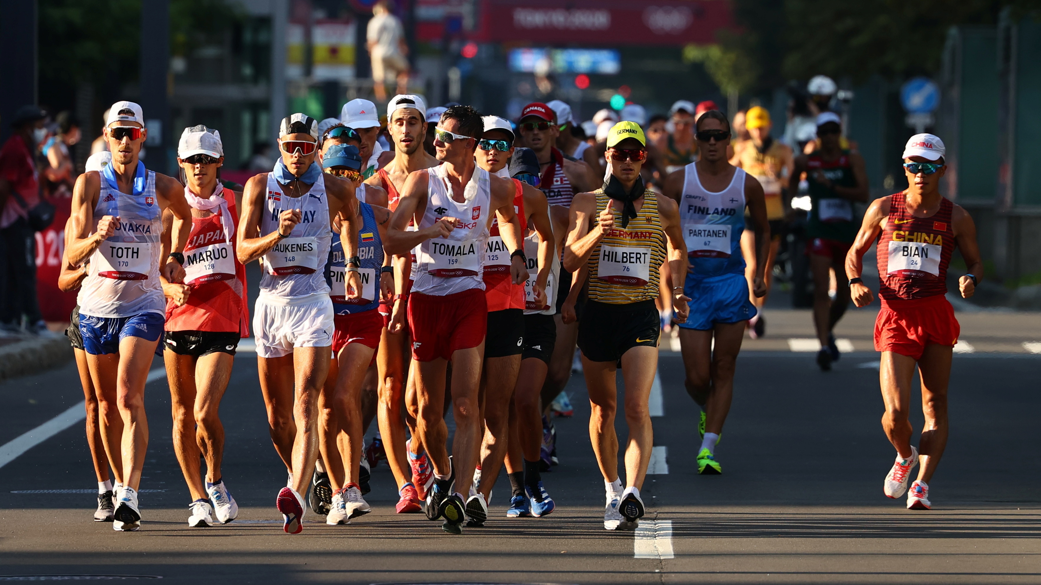 Gold medal switch, Tomala's triumph, 50km racewalk transition, Athletics dedication, 3540x1990 HD Desktop