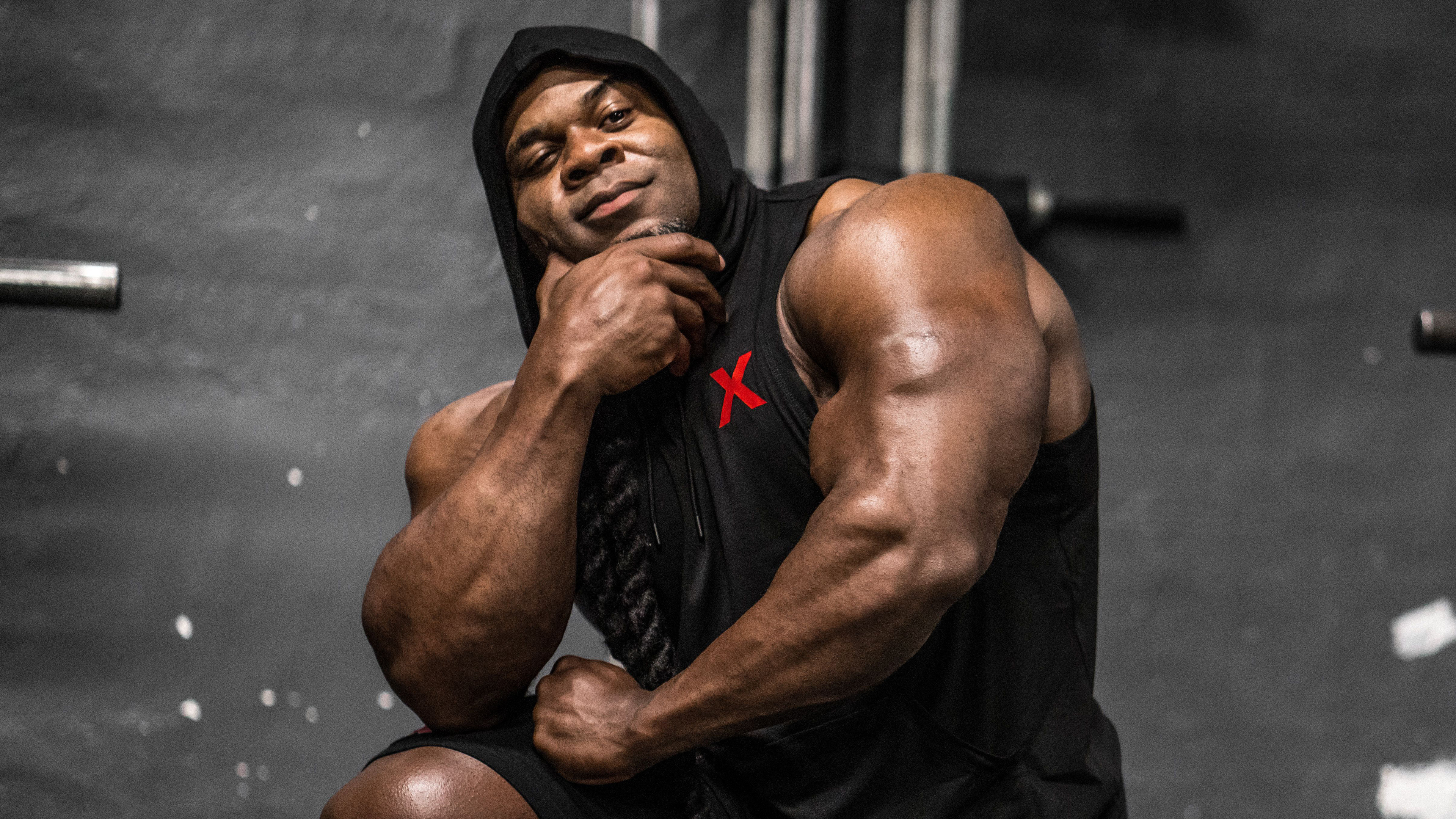 Kai Greene, Muscular bicep flex, Black sleeveless hoodie, 4K Desktop wallpaper