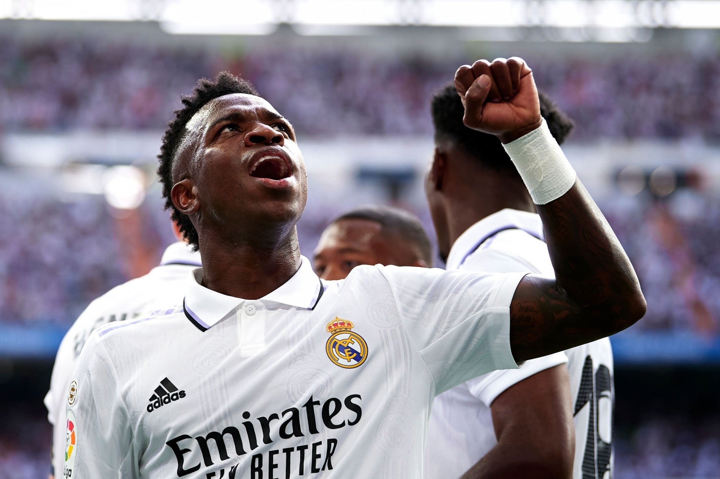 Vinicius Junior celebrating, Real Madrid home kit, Santiago Bernabeu stadium crowd, HD Desktop wallpaper