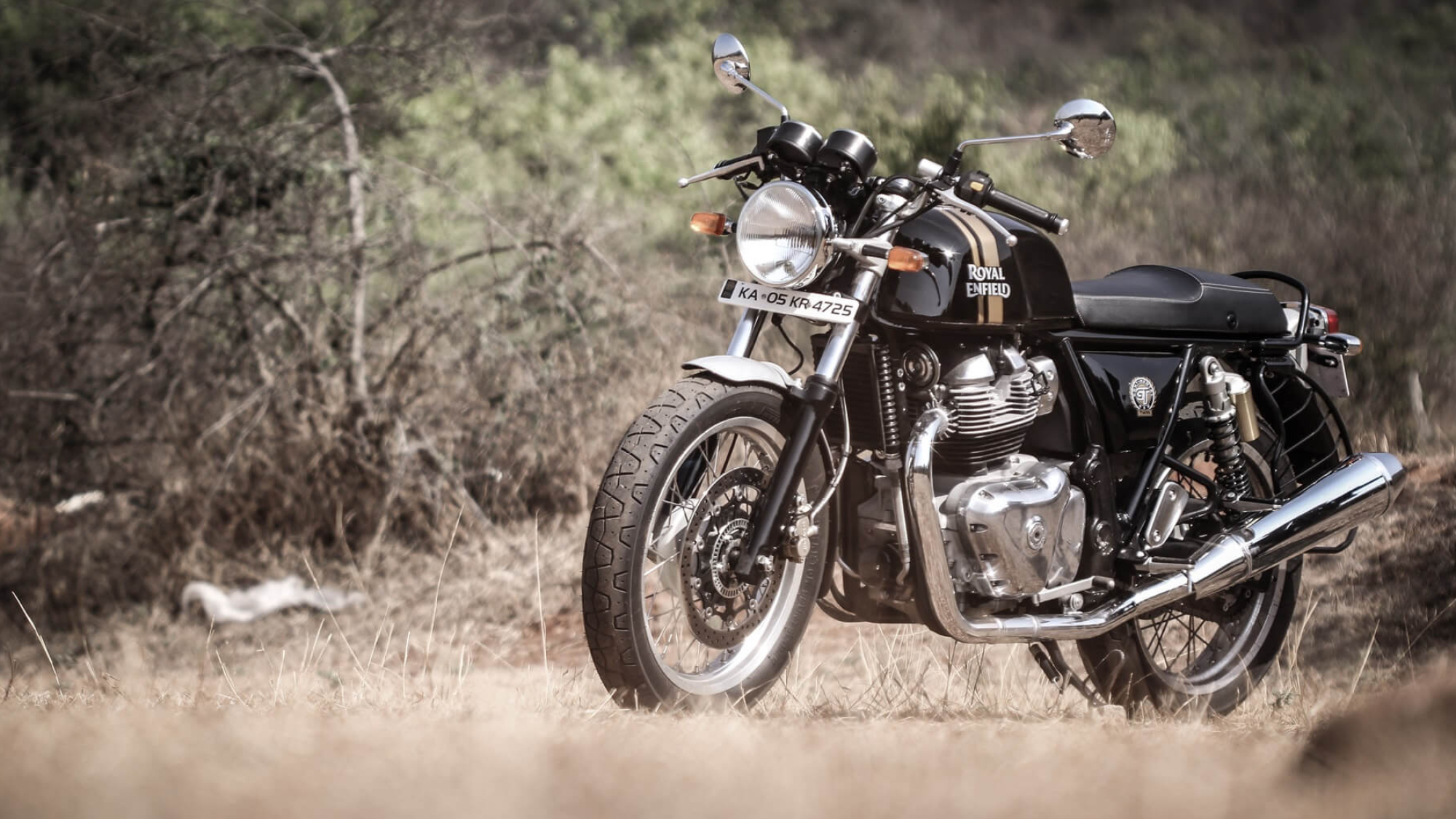 Royal Enfield Continental GT 650, Chrome twin exhaust pipe, Dry grass field landscape, HD Desktop wallpaper