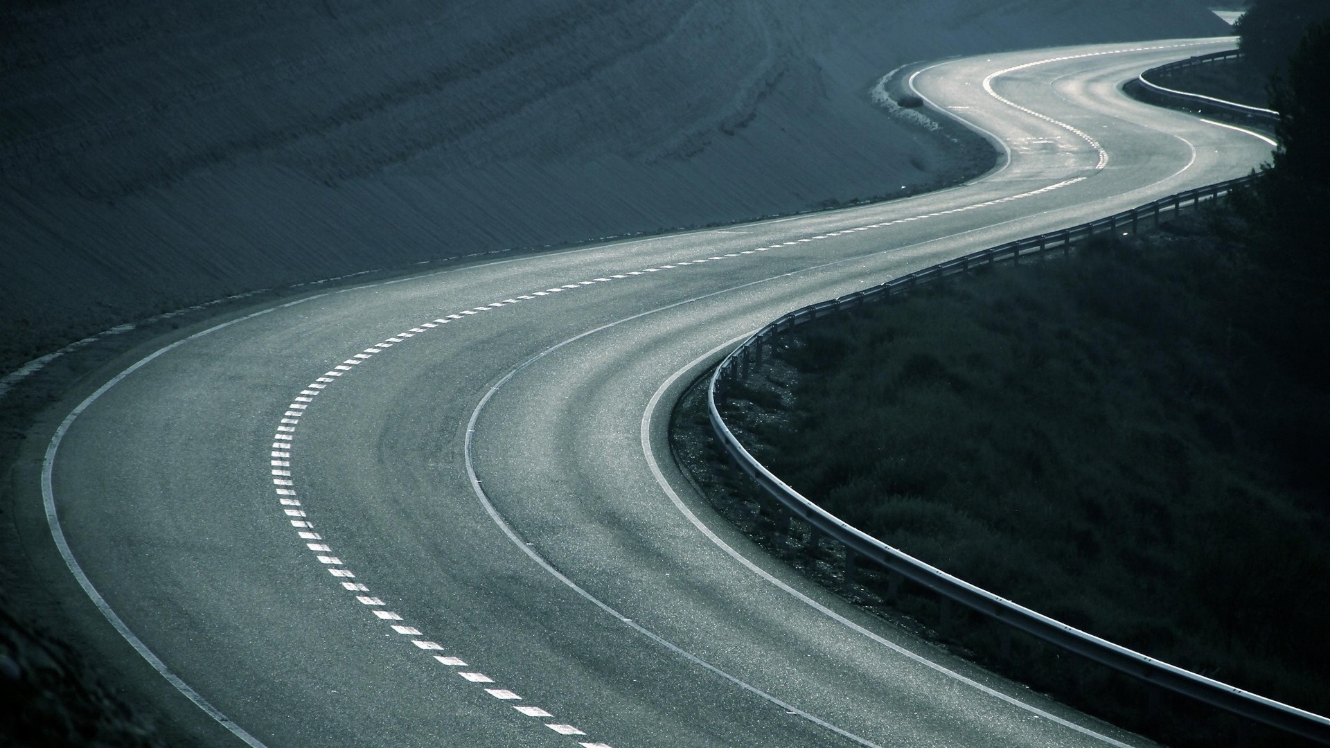 winding serpentine asphalt road, metal highway guardrail, dashed white road markings, Full HD Desktop wallpaper