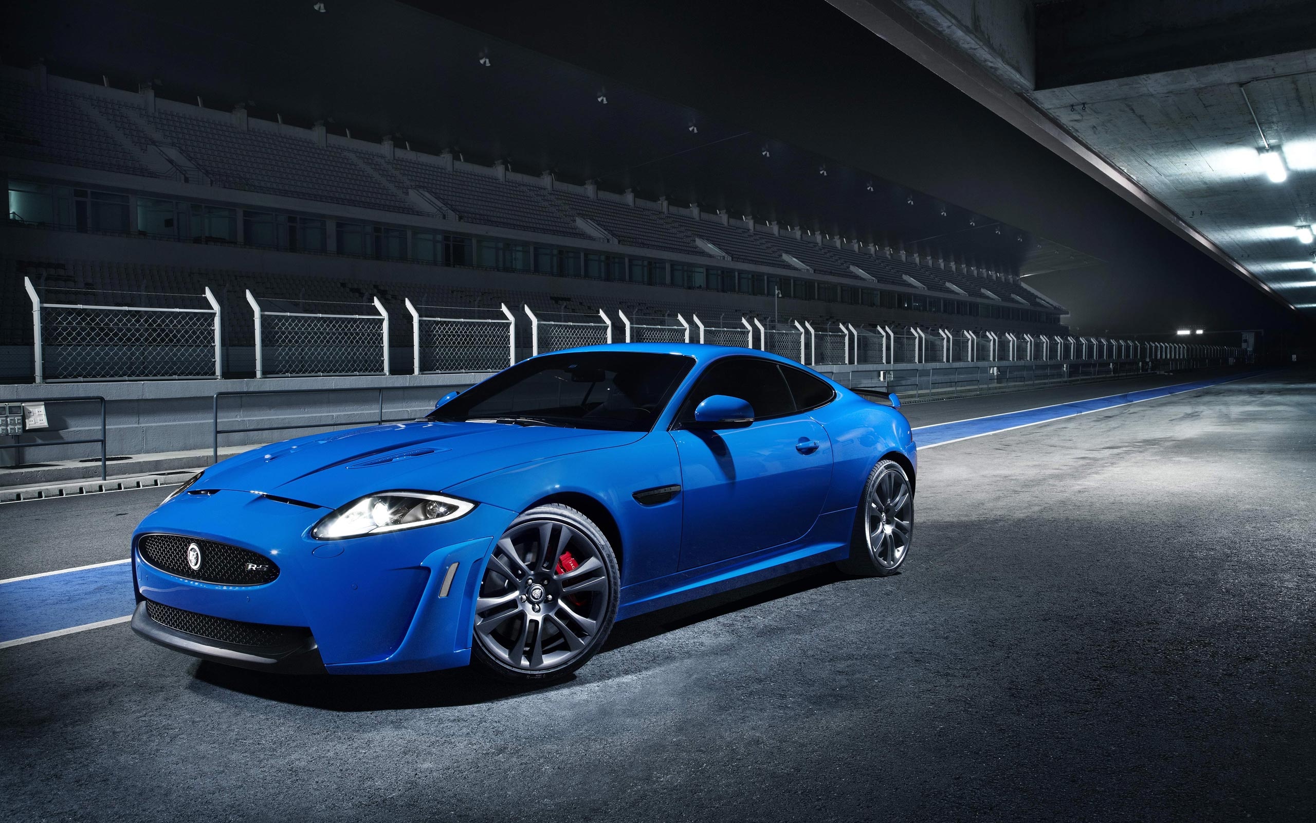 Jaguar XKR-S, racetrack pit lane, grandstand at night, HD Desktop wallpaper