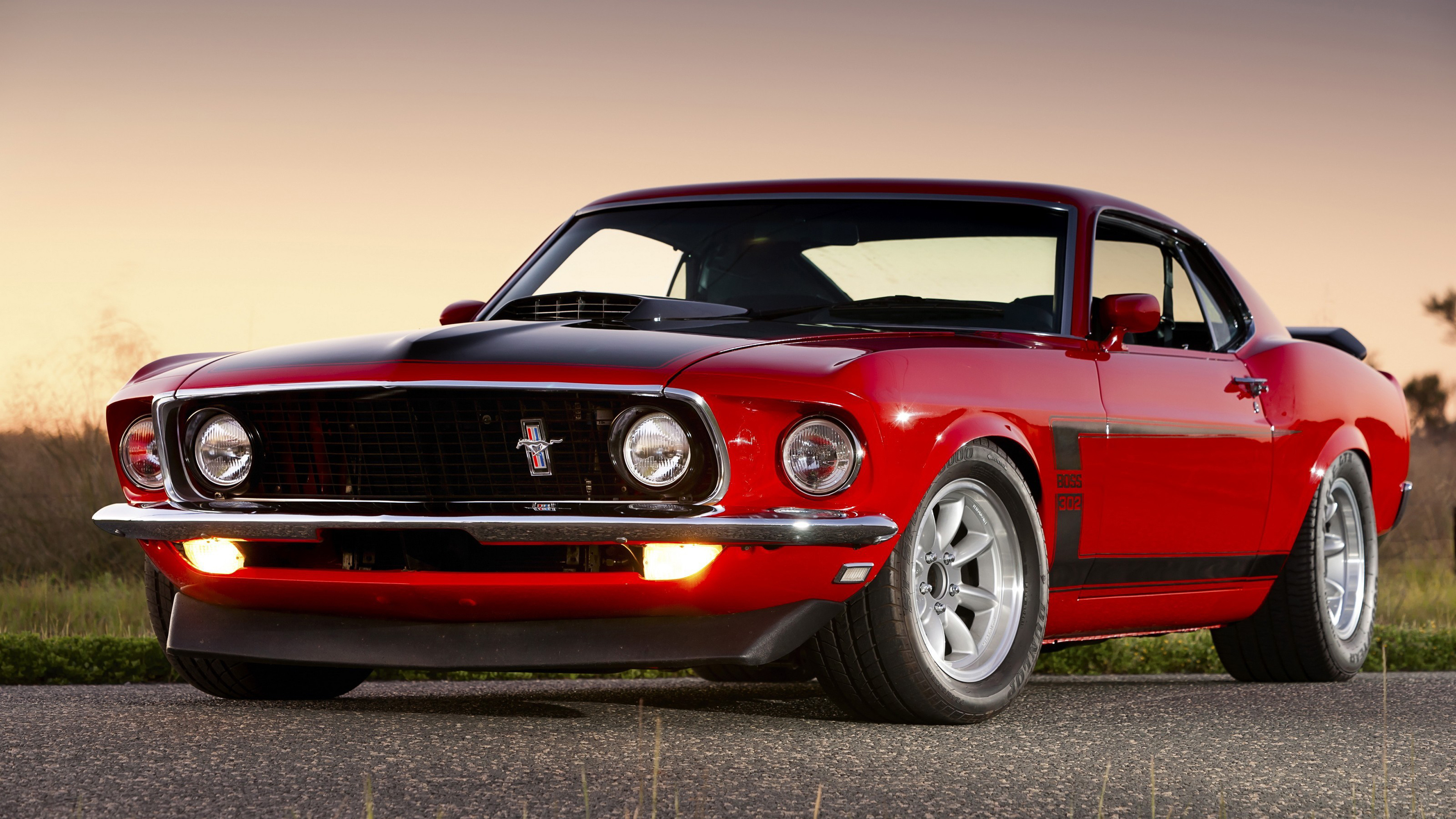 1969 Ford Mustang Boss 302, Candyapple Red paint, Golden hour roadside sunset, 4K Desktop wallpaper