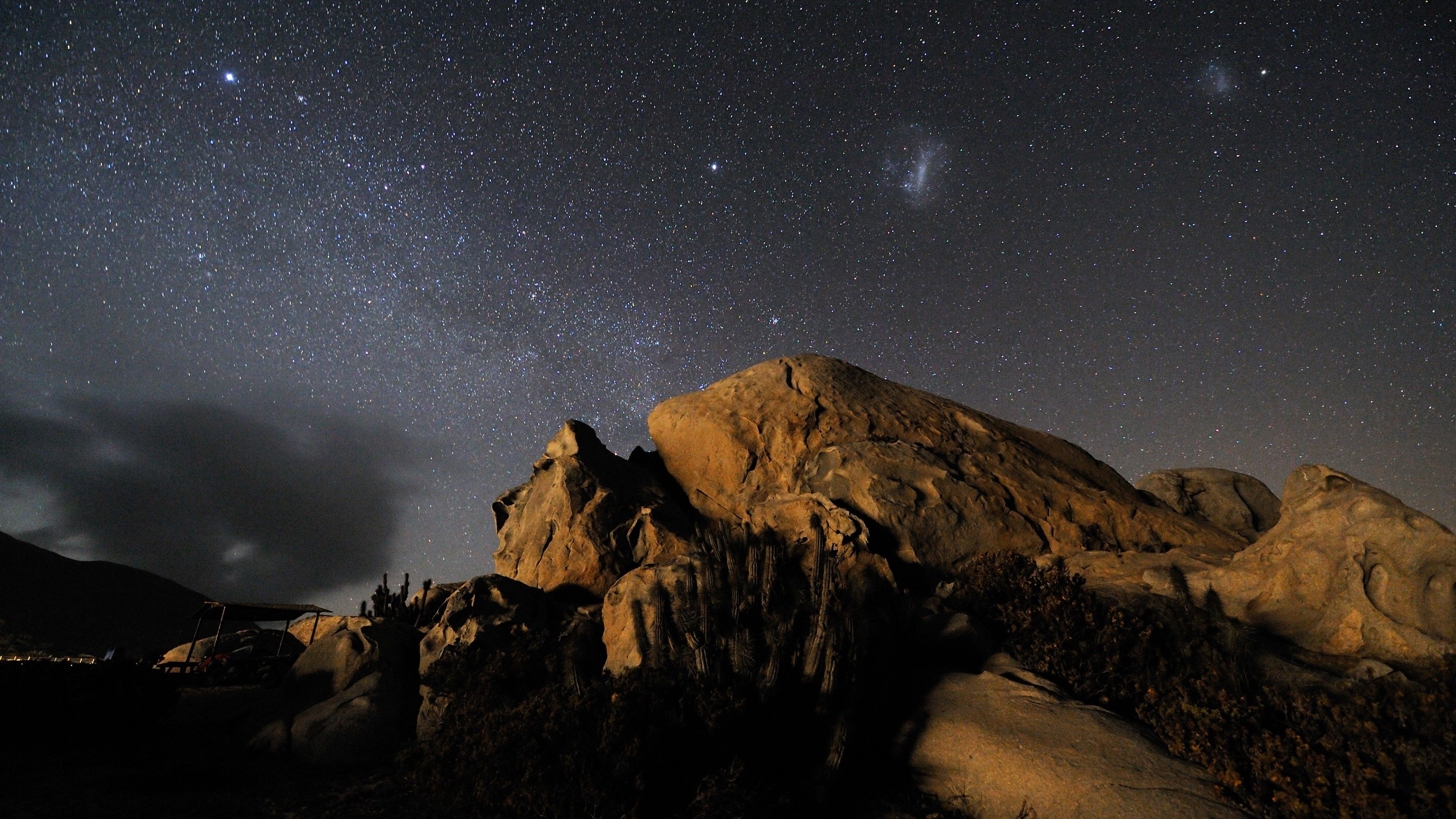 Magellanic Clouds, desert boulder outcrop, starry night sky, 4K Desktop wallpaper